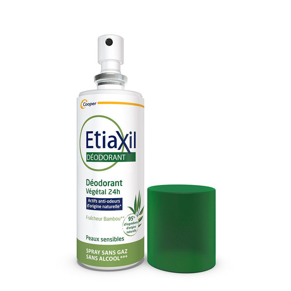 Spray déodorant Etiaxil avec bouchon enlevé. Flacon blanc, bouchon vert. Tête de pulvérisation visible.