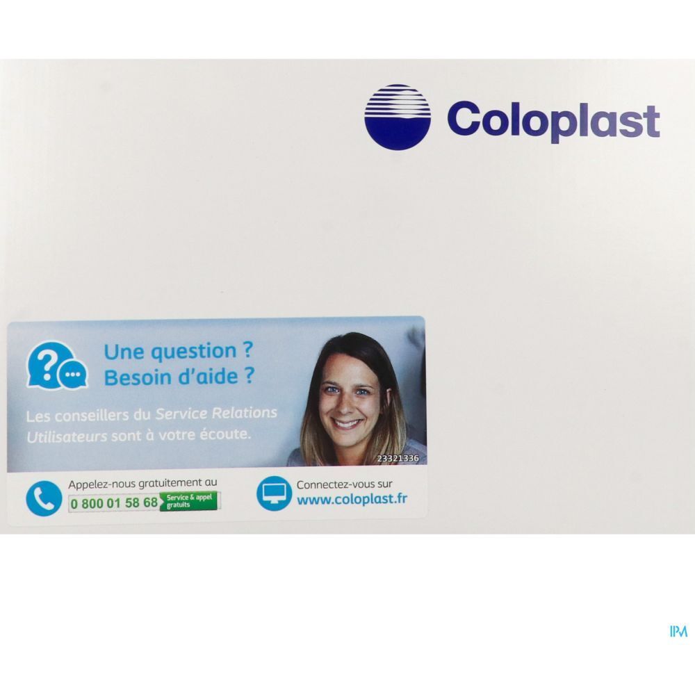 Emballage blanc avec logo Coloplast et informations de contact. Un autocollant montre un visage souriant et des informations de contact.