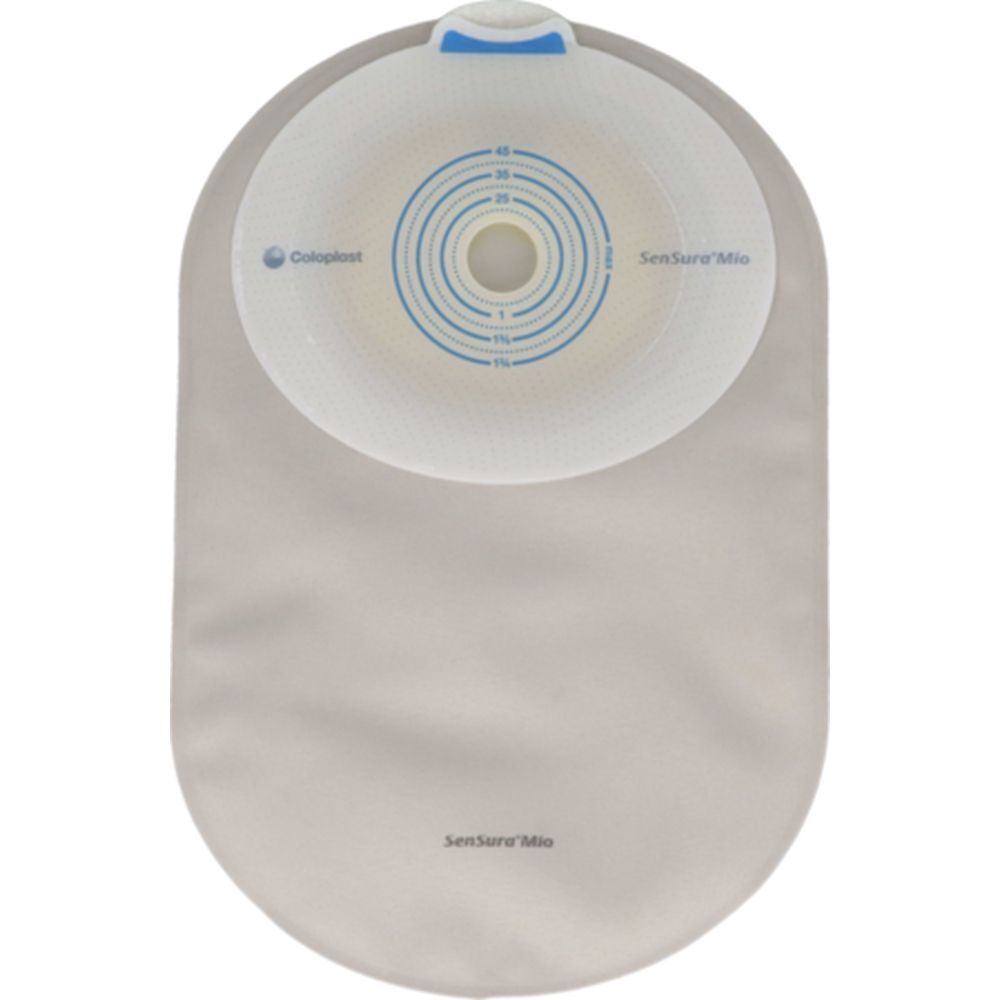 Poche avec bride adhésive blanche et ronde, poche gris clair. Échelle de mesure bleue. Marques: SenSura Mio, Coloplast.