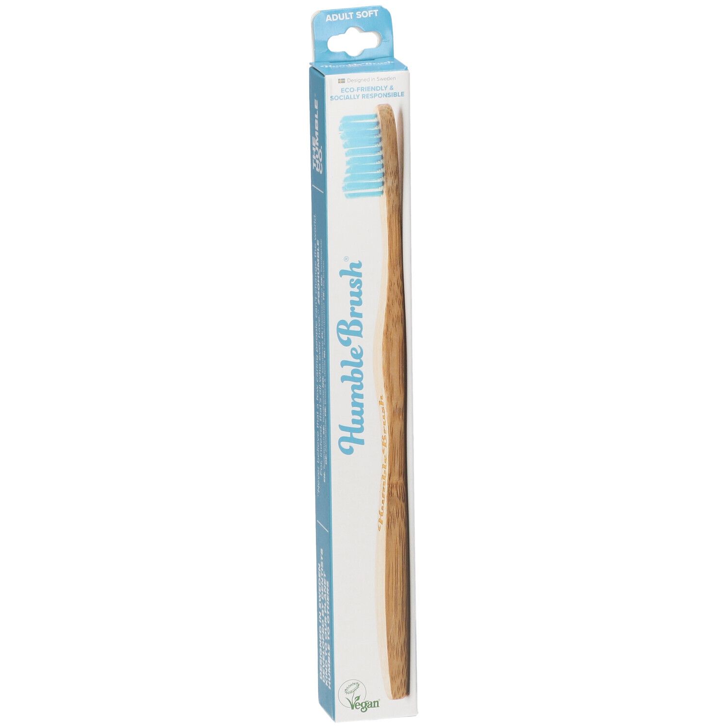 Brosse à dents bleue dans son emballage. Inscription: Humble Brush, Adult Soft, Vegan.