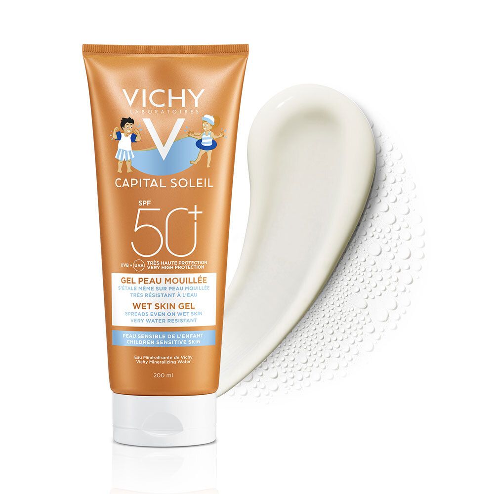Tube de crème solaire orange avec bouchon blanc et une goutte de crème. Inscriptions : VICHY, SPF 50+.
