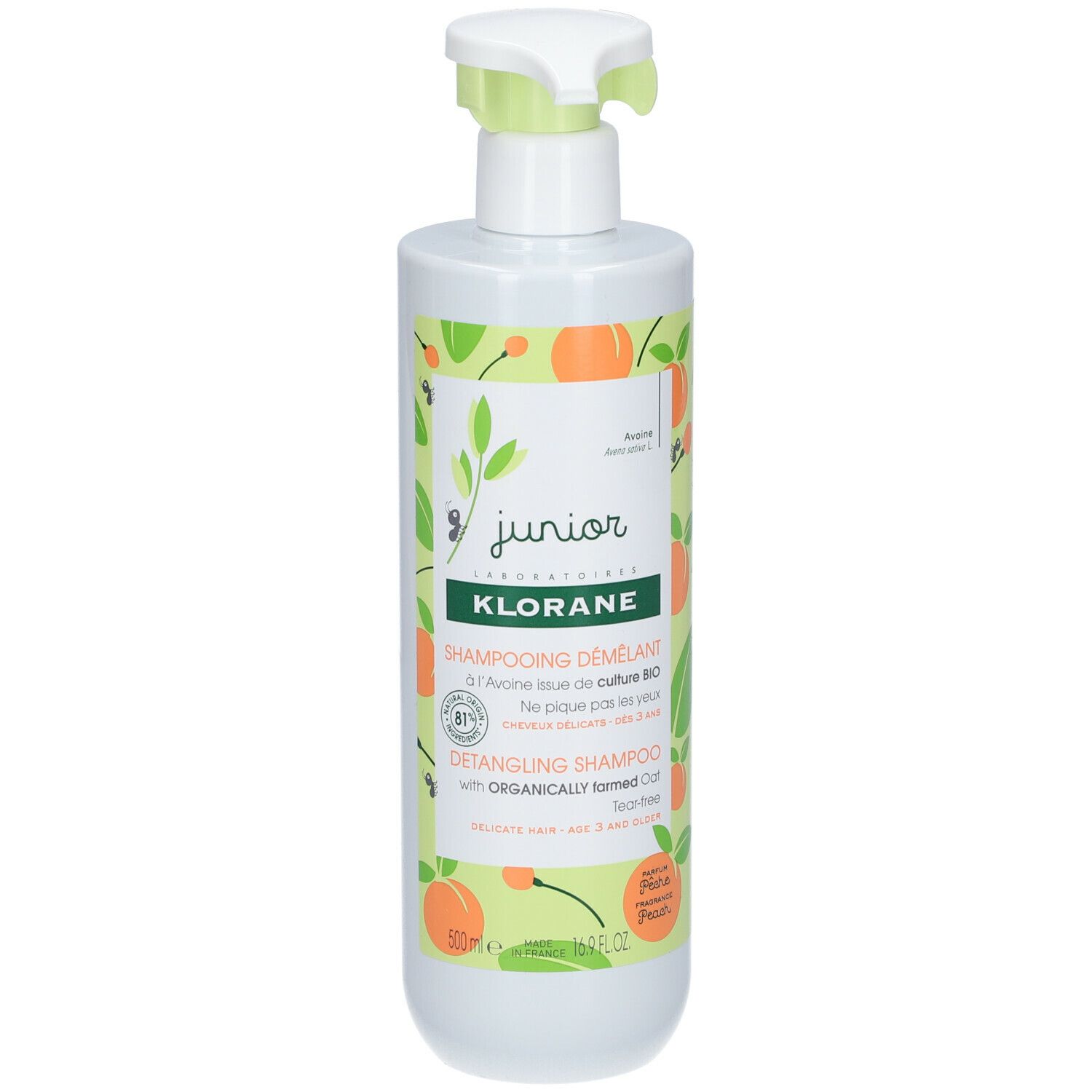 Flacon blanc avec pompe verte. Étiquette avec motifs de pêches et texte: KLORANE, Shampooing démêlant, Detangling Shampoo.