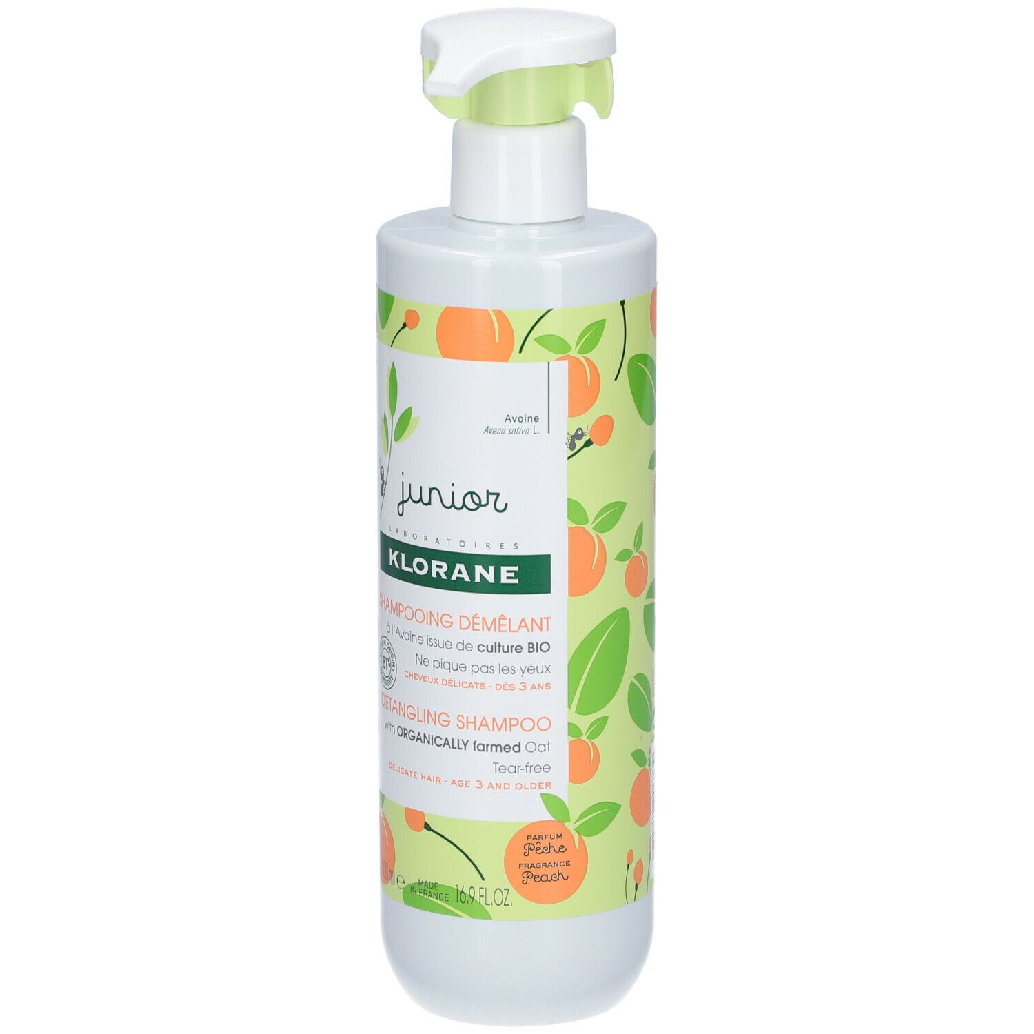 Flacon blanc avec pompe verte. Étiquette avec motifs de pêches et texte: KLORANE, Shampooing démêlant, Detangling Shampoo.