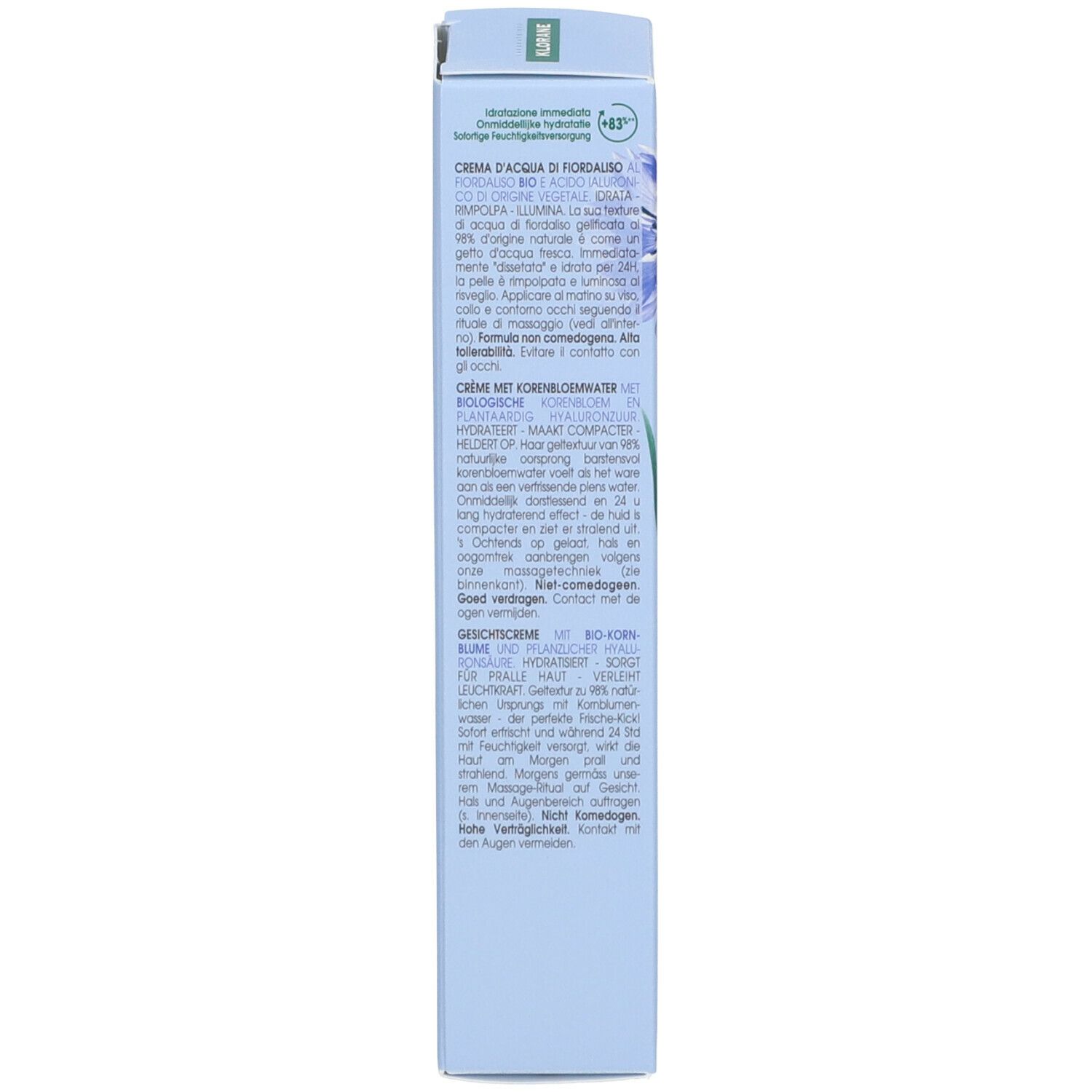 Dos de la boîte bleu clair. Texte en plusieurs langues. Contient des informations sur la Crème d'Eau de Bleuet.