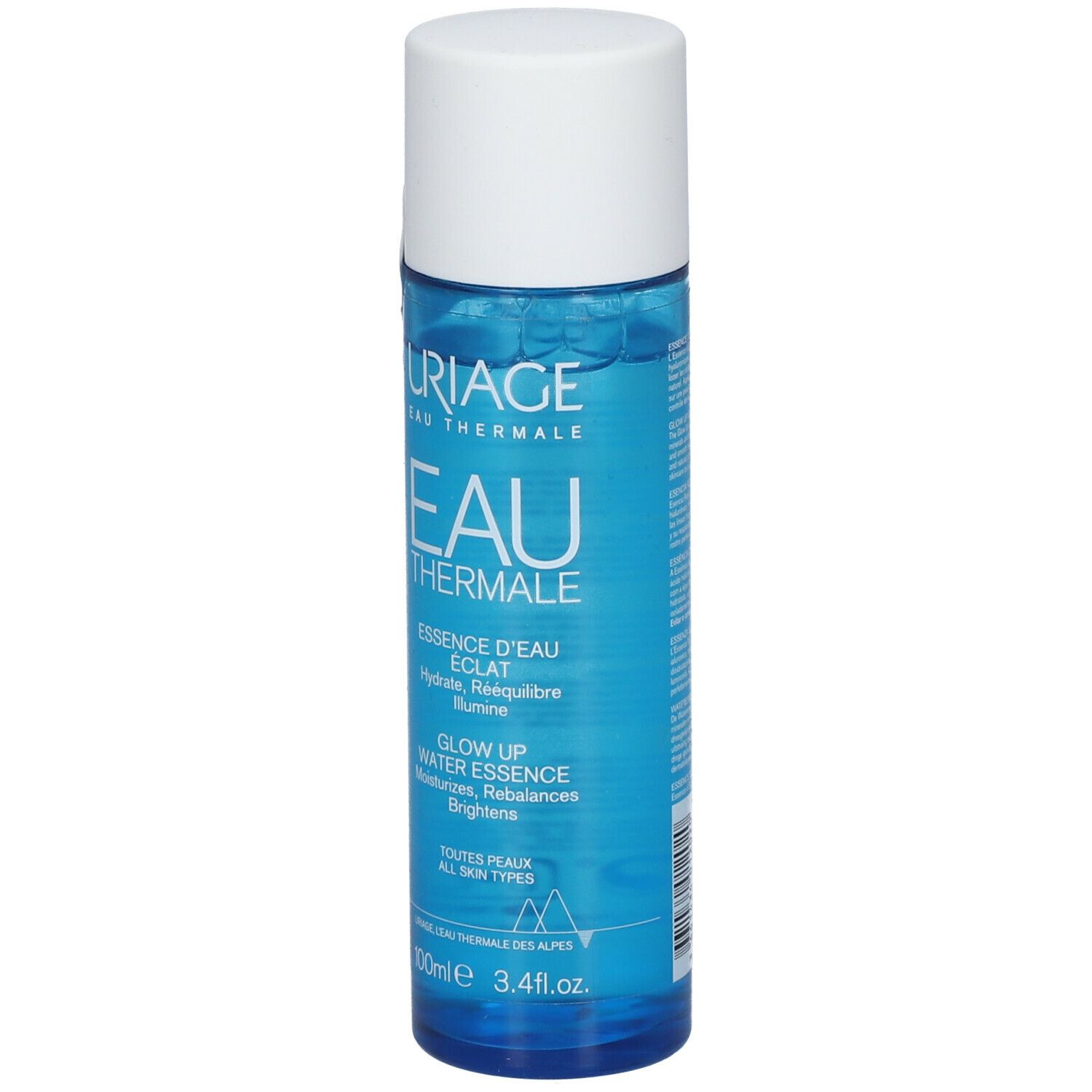 Flacon bleu avec bouchon blanc. Inscription: URIAGE Eau Thermale, Essence d'Eau Éclat. Contient 100ml.