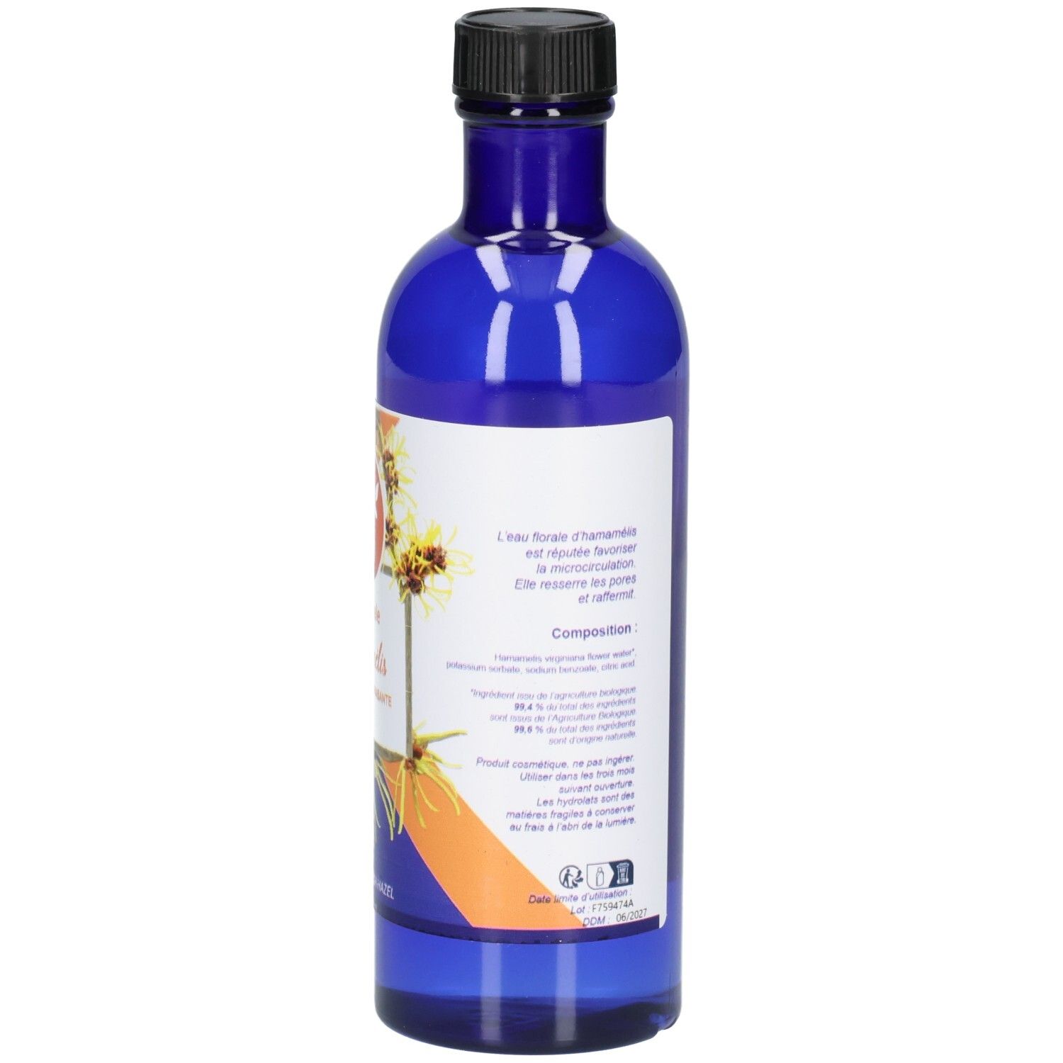 Arrière d'une bouteille en verre bleue avec étiquette pour Belle 'Oemine Bio Eau Florale Hamamélis.