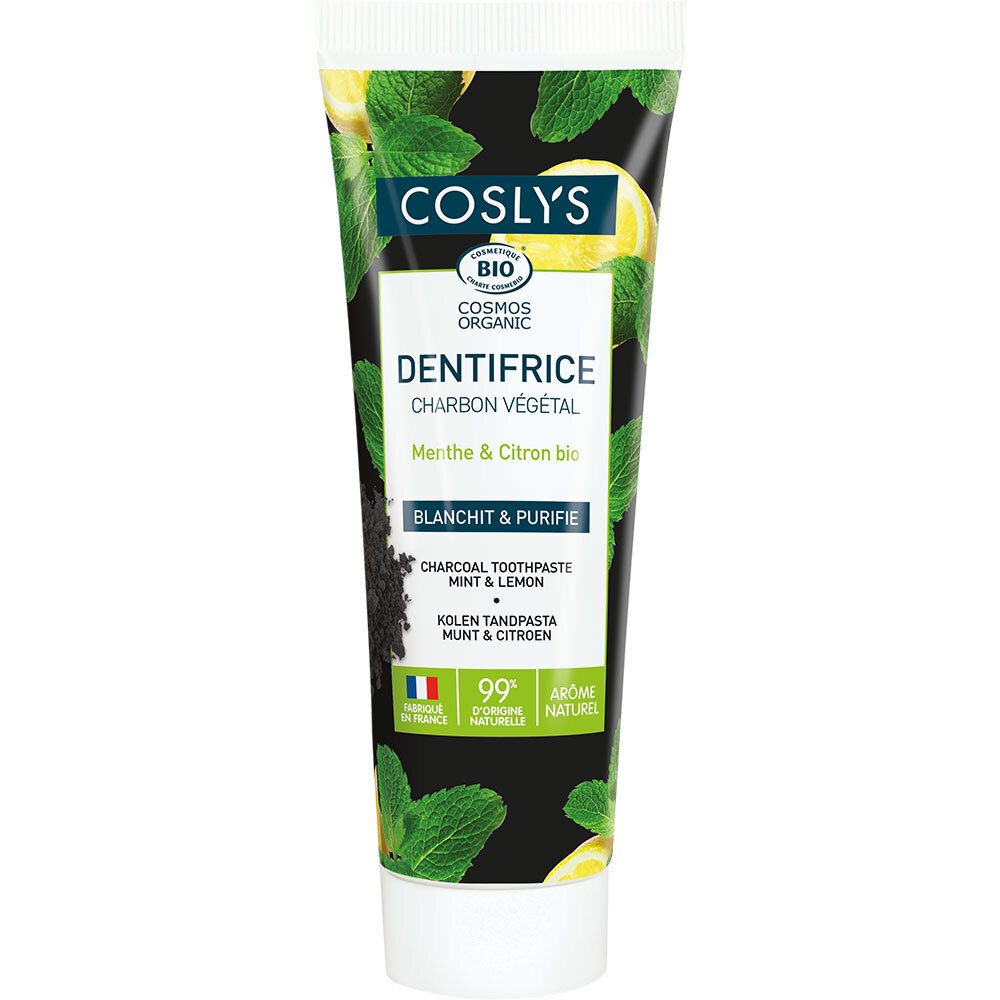 Tube de dentifrice avec fond noir, feuilles vertes et citrons. Texte: COSLYS, Dentifrice, Charbon Végétal, Menthe & Citron bio.