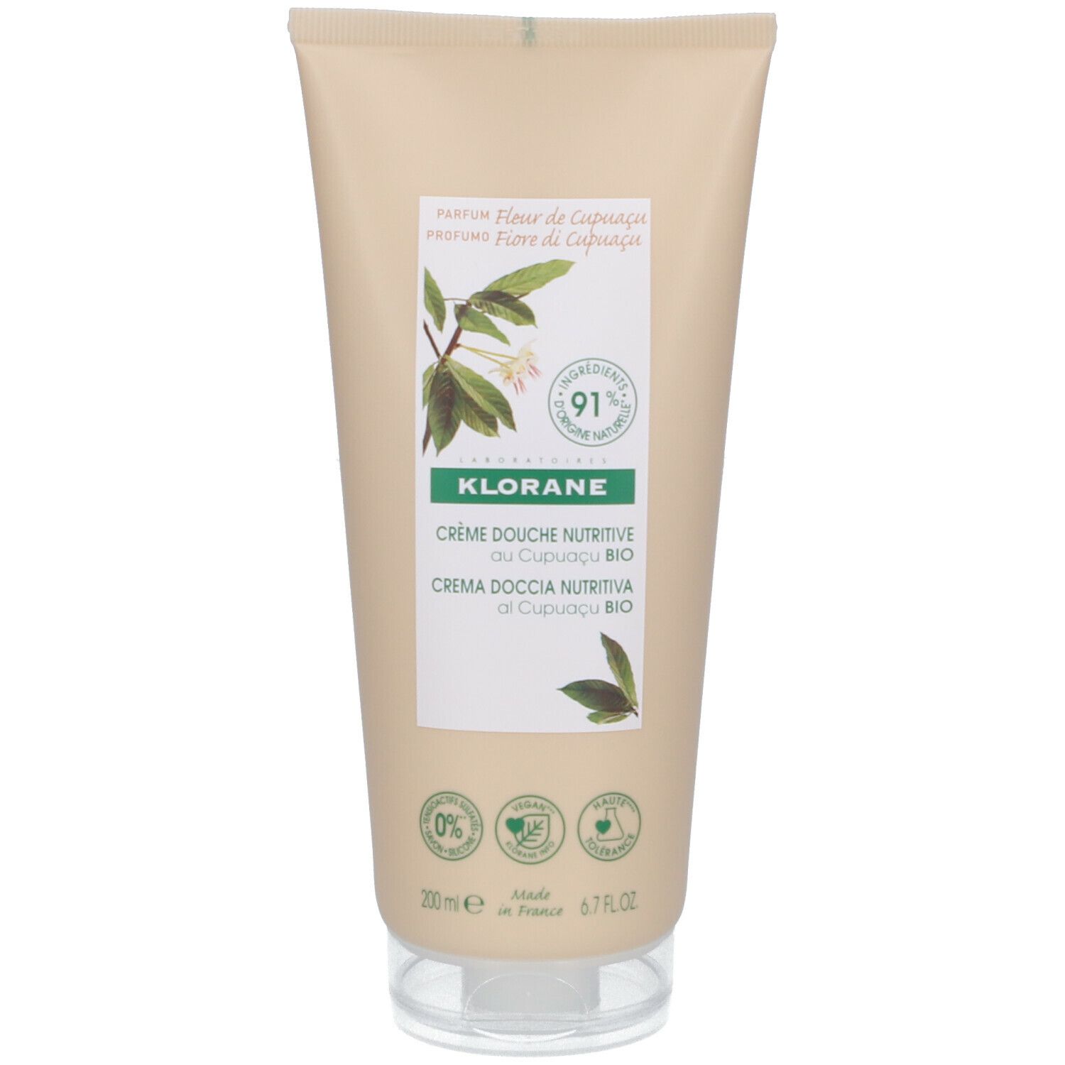 Tube beige avec bouchon blanc. Inscription : Klorane, Crème Douche Nutritive au Cupuaçu BIO. Étiquettes vertes et blanches.