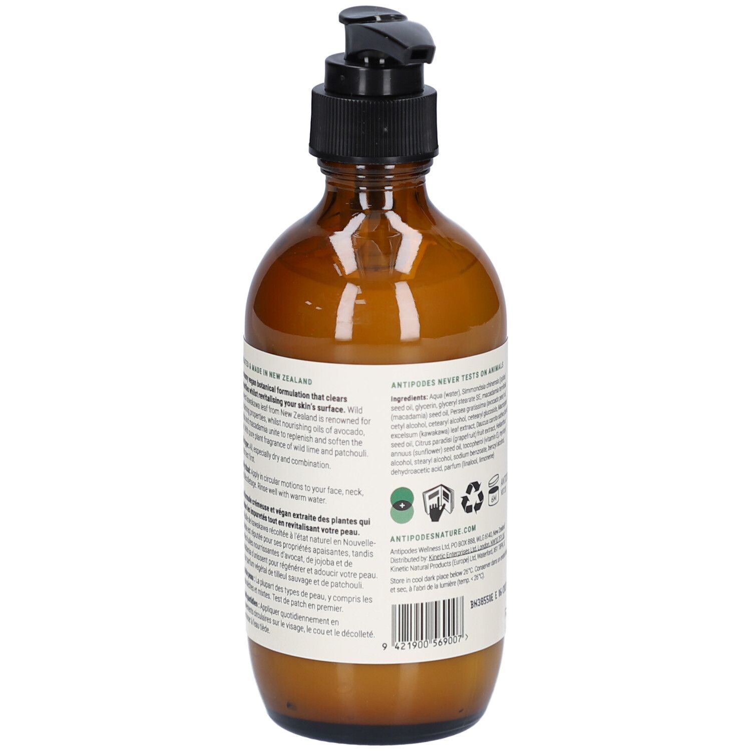 Flacon en verre brun, vue arrière. Étiquette avec informations produit, ingrédients et symboles de recyclage. Pompe noire.