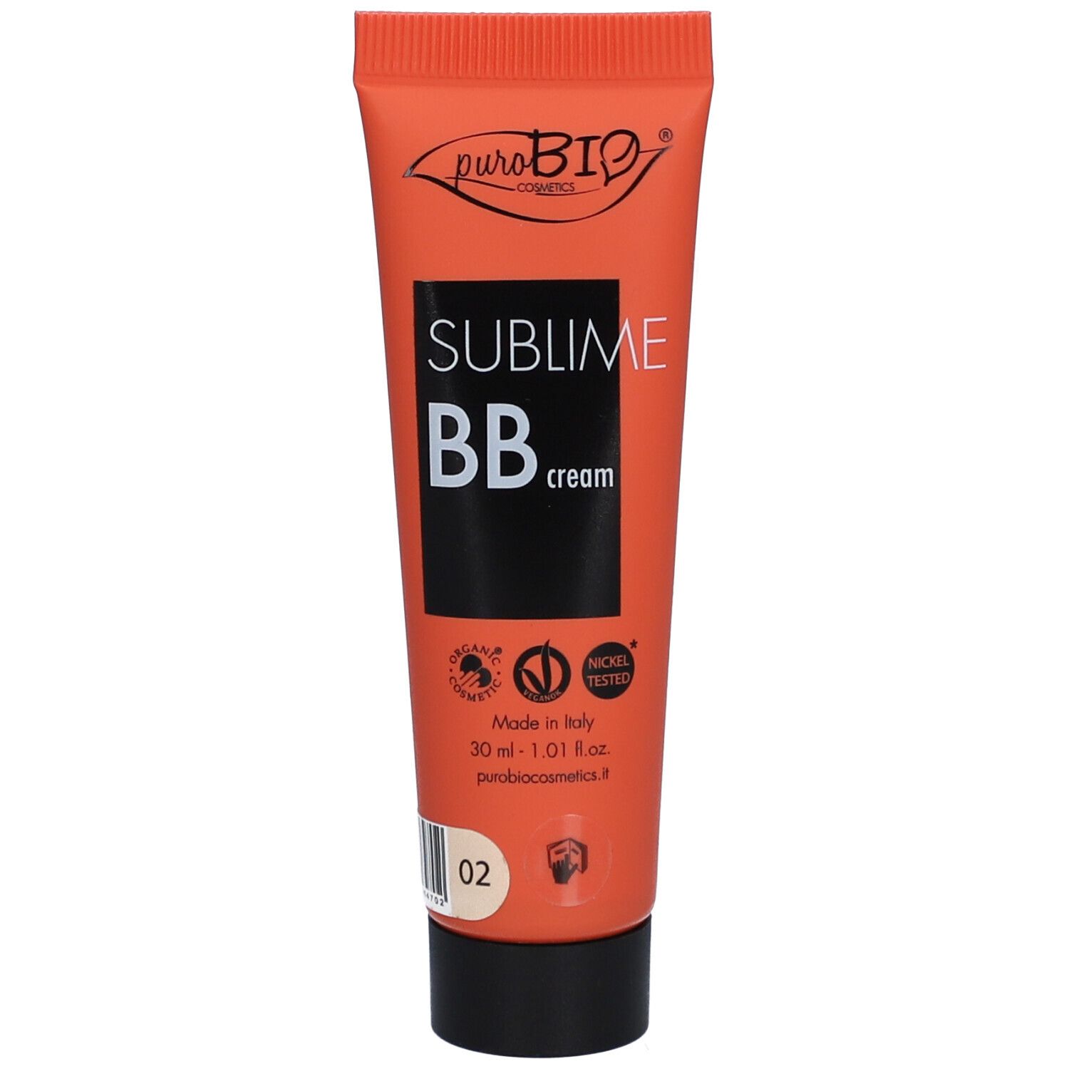 Tube orange avec bouchon noir. Inscription: Sublime BB cream. Marque: Purobio. Avec texte et numéro de couleur 02.