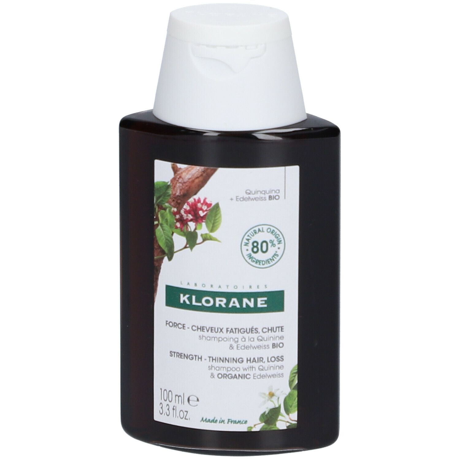 Flacon brun avec bouchon blanc. Étiquette avec informations produit et logo: KLORANE. Texte: Shampooing Bio-Chinin & Edelweiss.