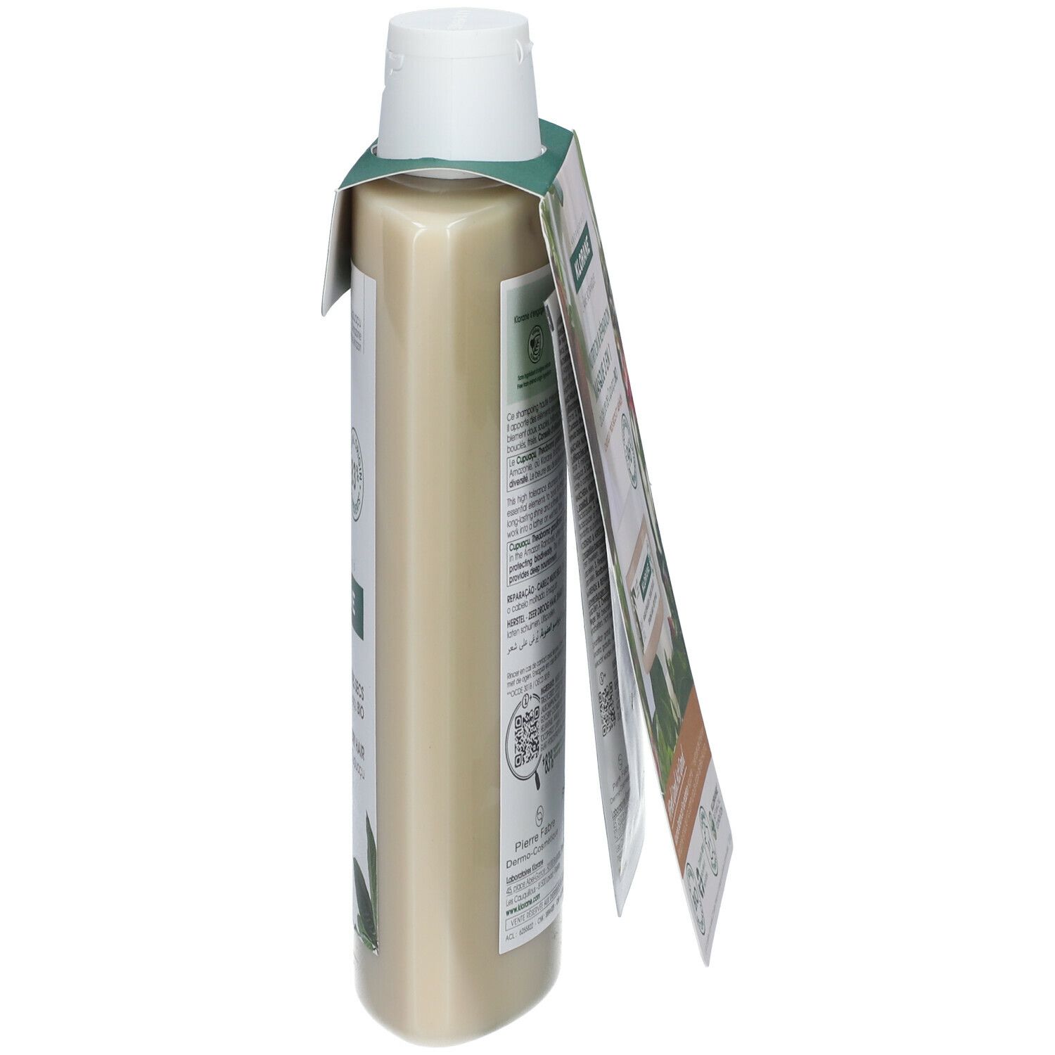 Dos d'un flacon de shampooing avec étiquette. Texte multilingue. Informations sur les ingrédients et certifications.