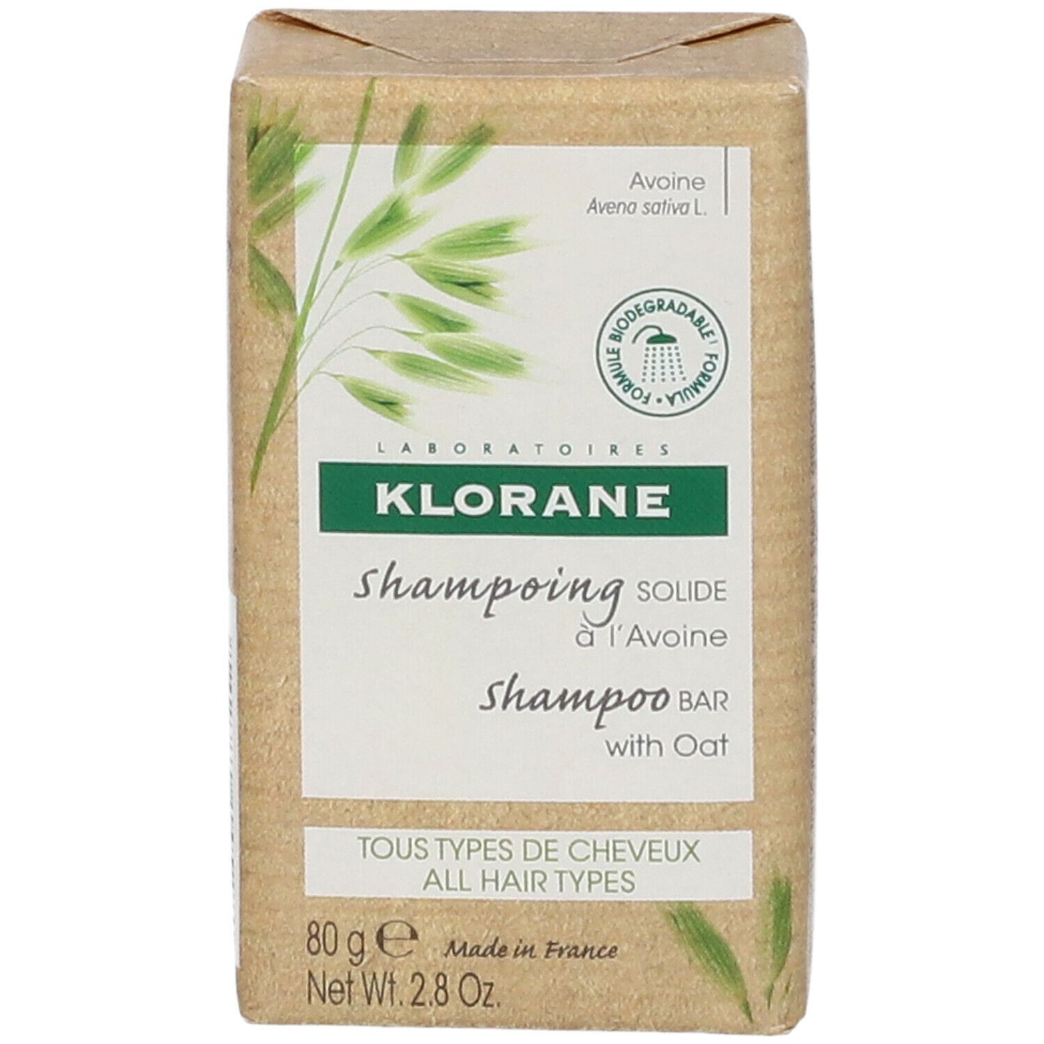 Emballage carton avec KLORANE shampooing solide à l'Avoine. Inscription: Tous types de cheveux.
