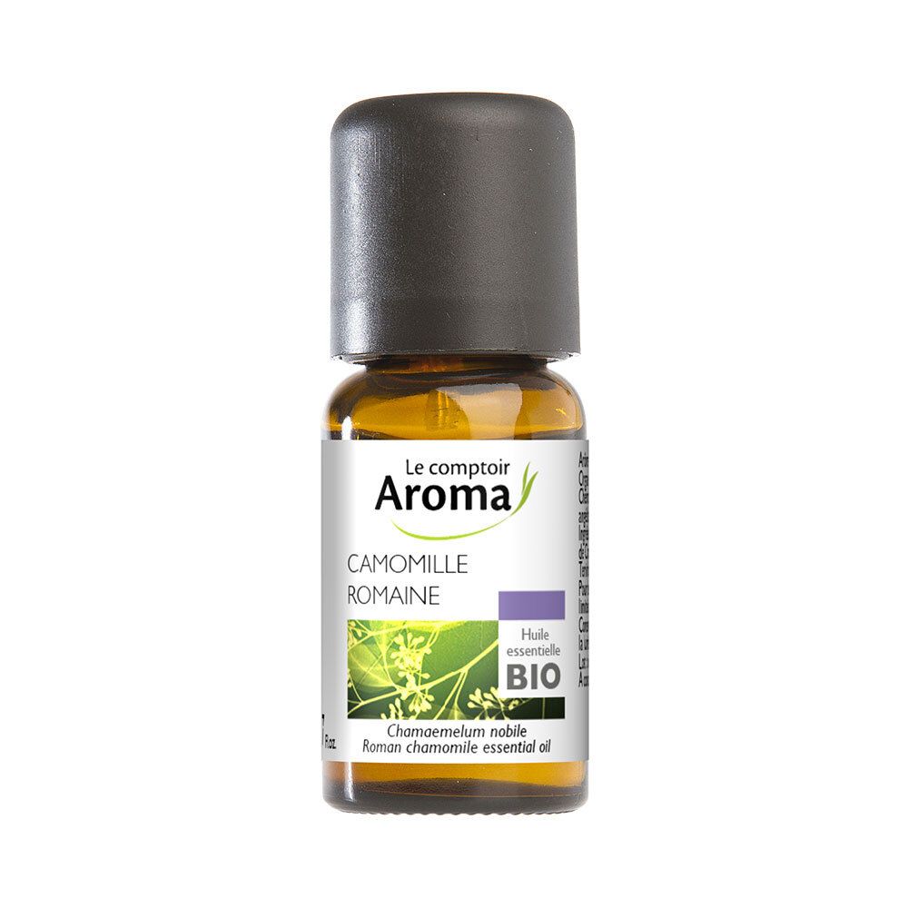 Flacon brun avec bouchon noir. Étiquette avec informations produit et label bio. Huile de camomille.