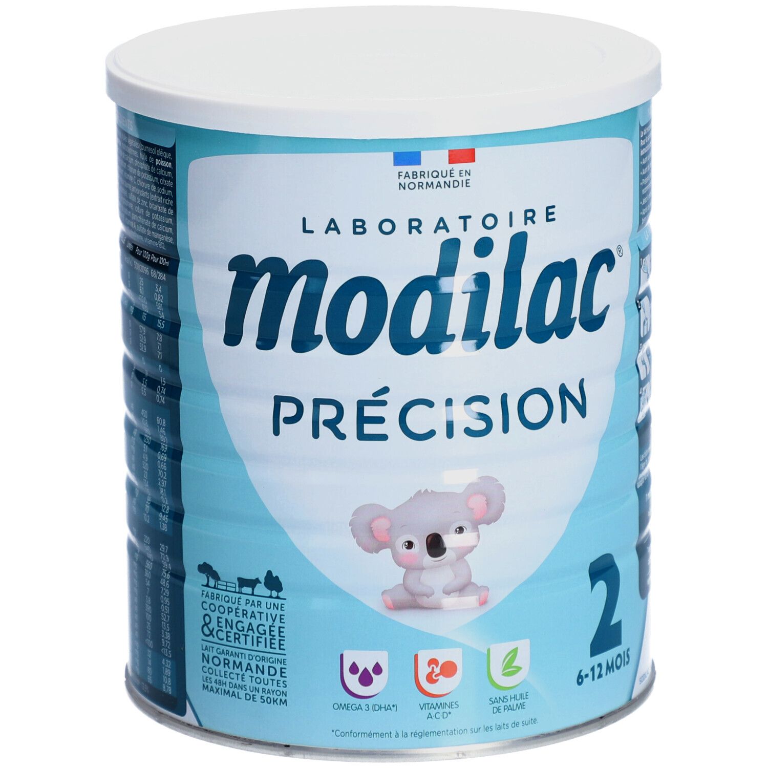 Boîte bleu clair avec couvercle blanc. Inscription: Modilac Précision, 2, 6-12 mois. Illustration koala.