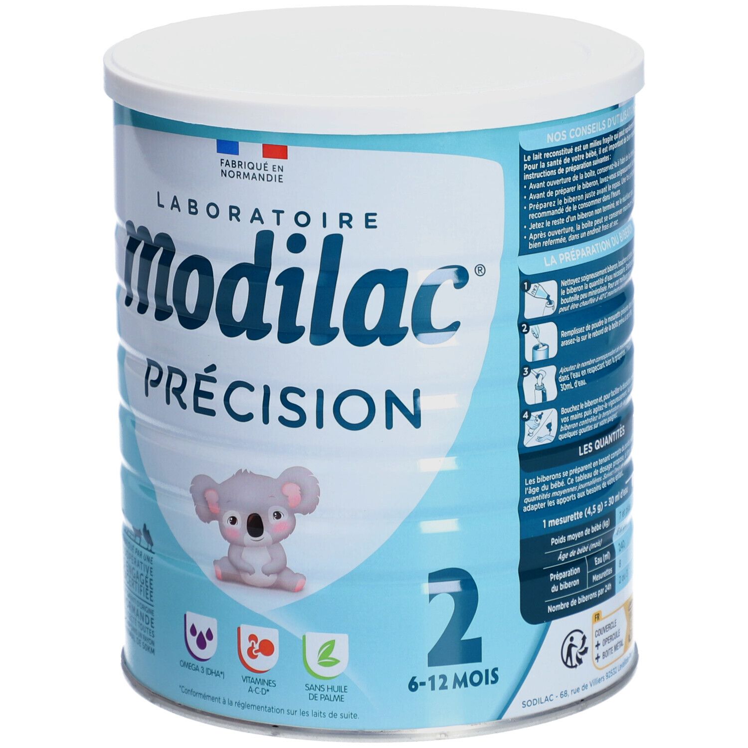 Boîte bleu clair avec couvercle blanc. Inscription: Modilac Précision, 2, 6-12 mois. Illustration koala. Instructions.