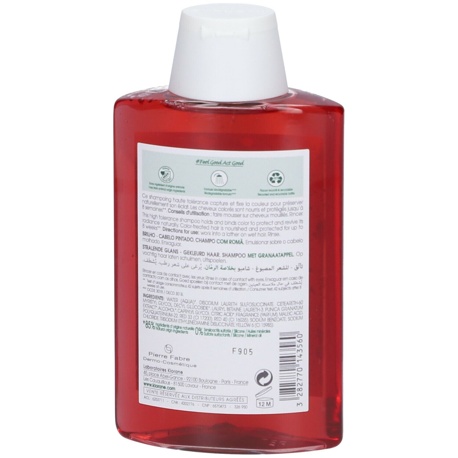 Dos du flacon de shampooing rouge. Informations textuelles et ingrédients. Symbole de recyclage.