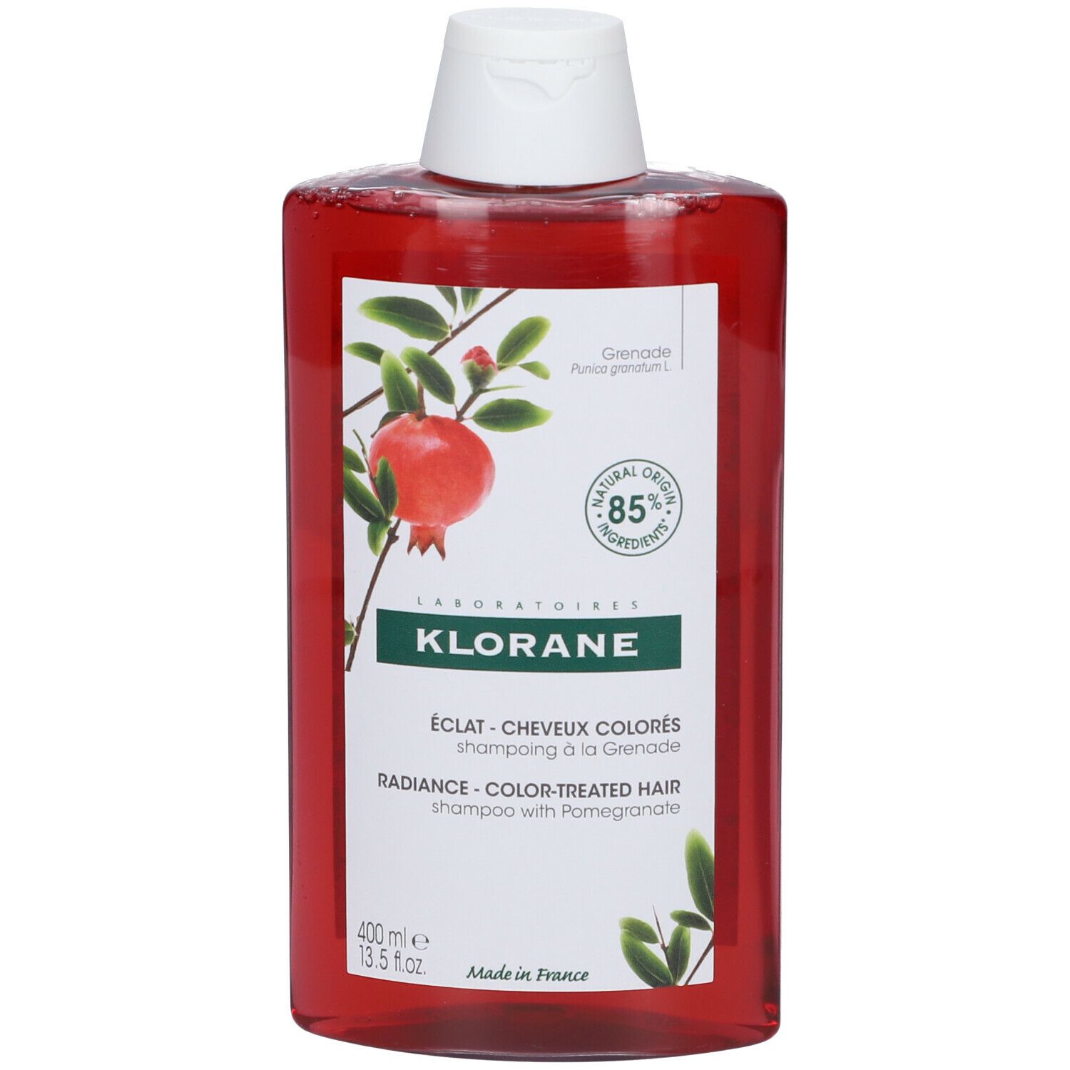 Flacon rouge avec bouchon blanc. Inscription: KLORANE, ÉCLAT - CHEVEUX COLORÉS, shampooing à la Grenade. 400 ml.