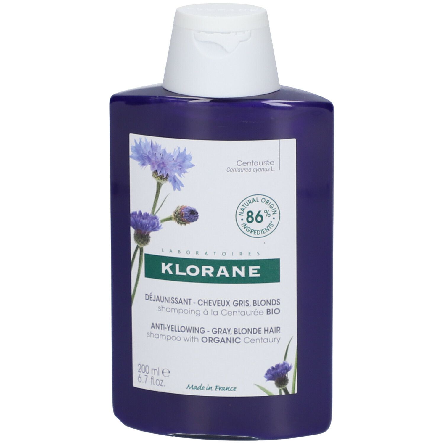 Flacon de shampooing bleu avec bouchon blanc. Inscription : Klorane, shampooing anti-jaunissement pour cheveux gris et blonds à la Centaurée Bio. 200 ml.