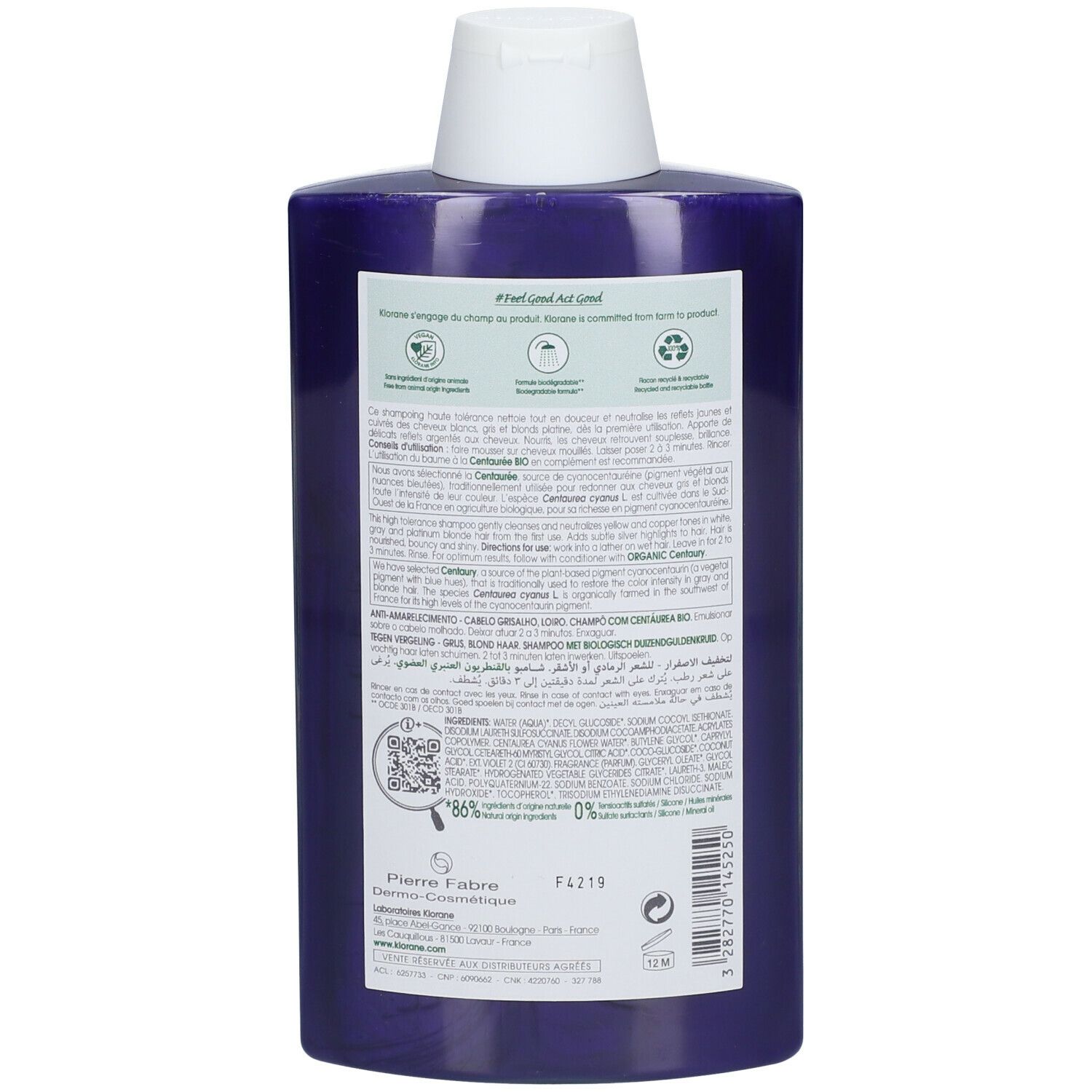 Dos du flacon de shampooing violet. Texte avec ingrédients, instructions d'utilisation et symboles de recyclage. Code QR et informations du fabricant.