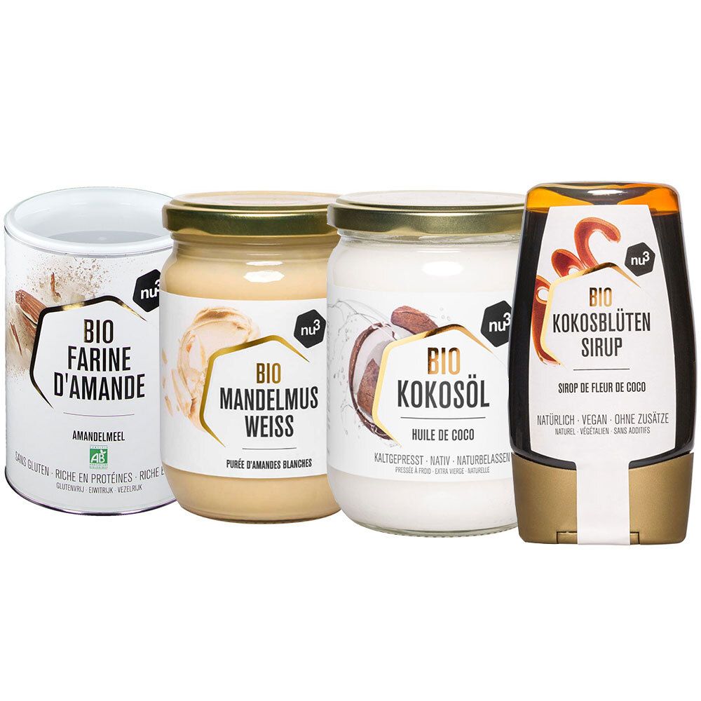 Quatre produits nu3 : farine d'amande bio, beurre d'amande bio, huile de coco bio et sirop de fleur de coco bio. Tous en pots et contenants étiquetés.