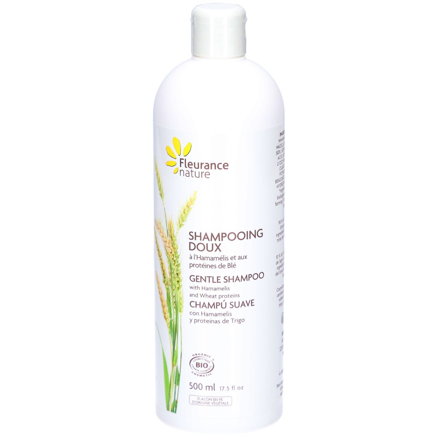 Flacon blanc de shampooing. Étiquette : DOUX, HAMAMELIS, protéines de blé. Certification bio. 500 ml.