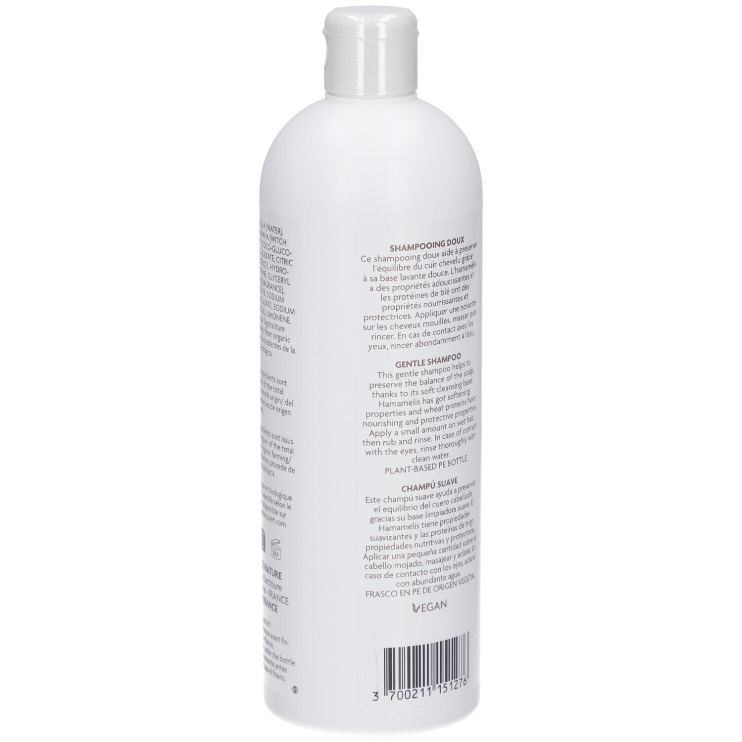 Dos du flacon de shampooing blanc. Texte : DOUX, HAMAMELIS, protéines de blé. Vegan. Plant Based Bottle.