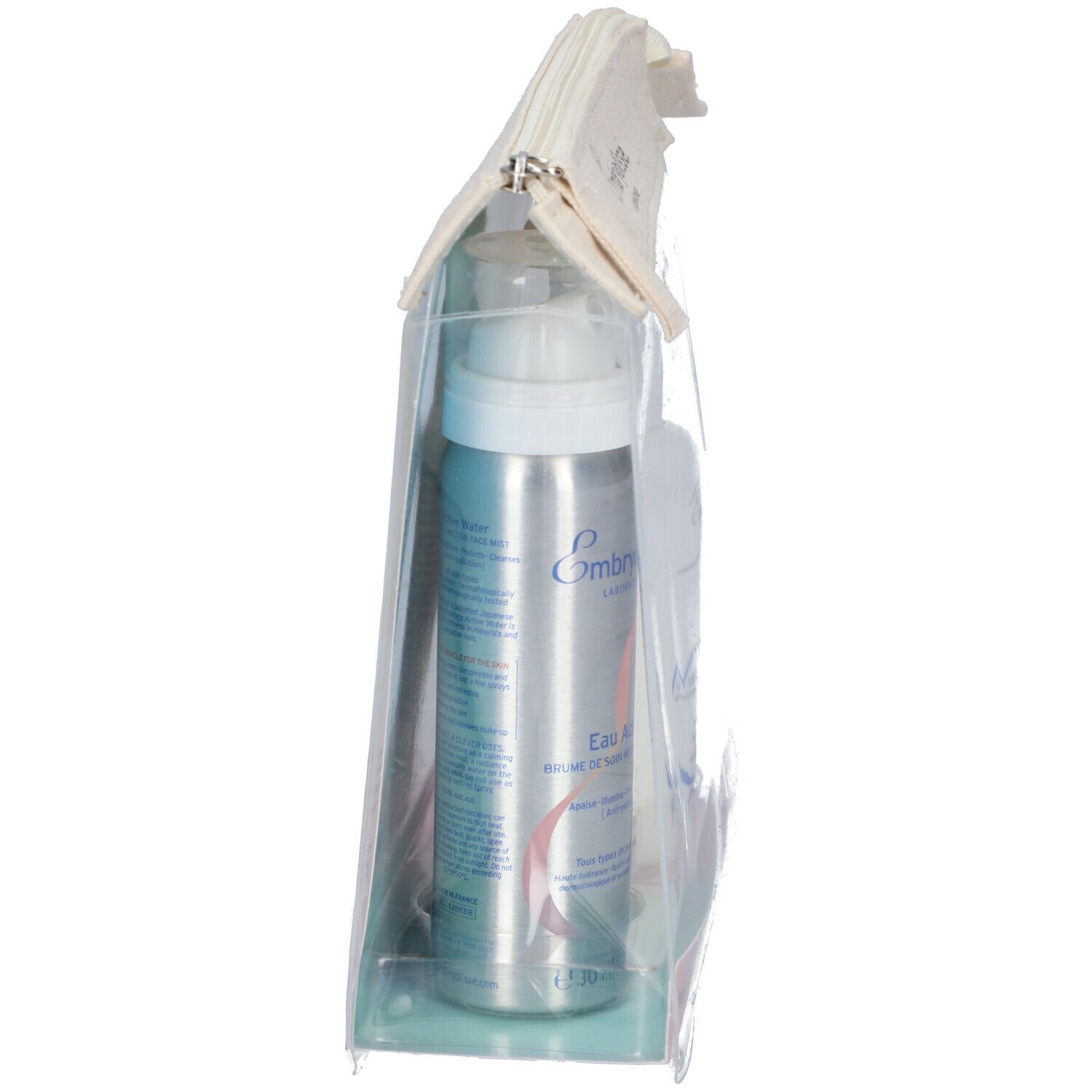 Vue latérale de la trousse transparente avec flacon spray. Inscription : Embryolisse, Eau Active.