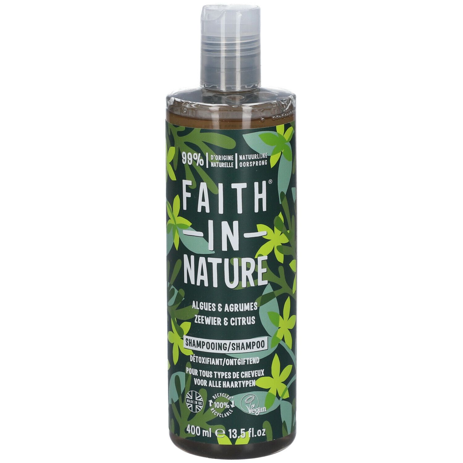 Flacon de shampooing avec étiquette verte. Inscription: Faith in Nature, Algues & Agrumes, Détoxifiant. Vegan.