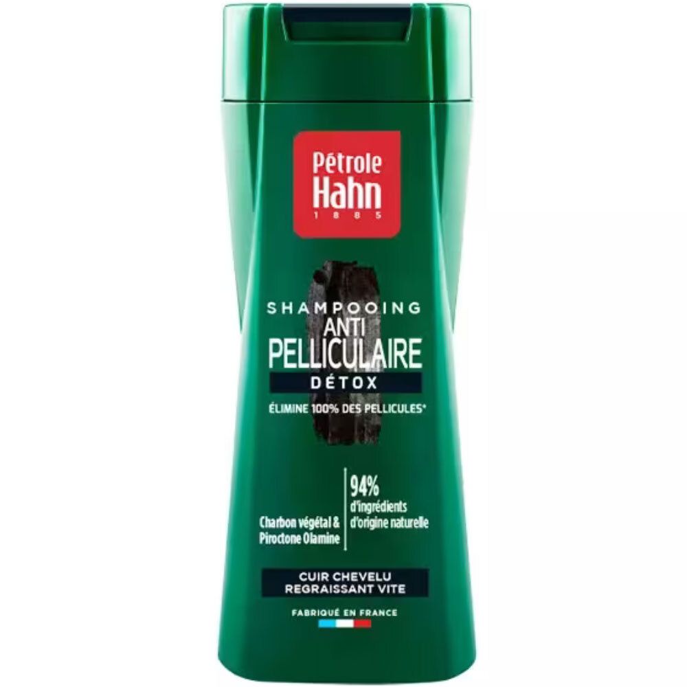 Shampoing antipelliculaire Détox Petrole Hahn dans une bouteille verte avec motif charbon.