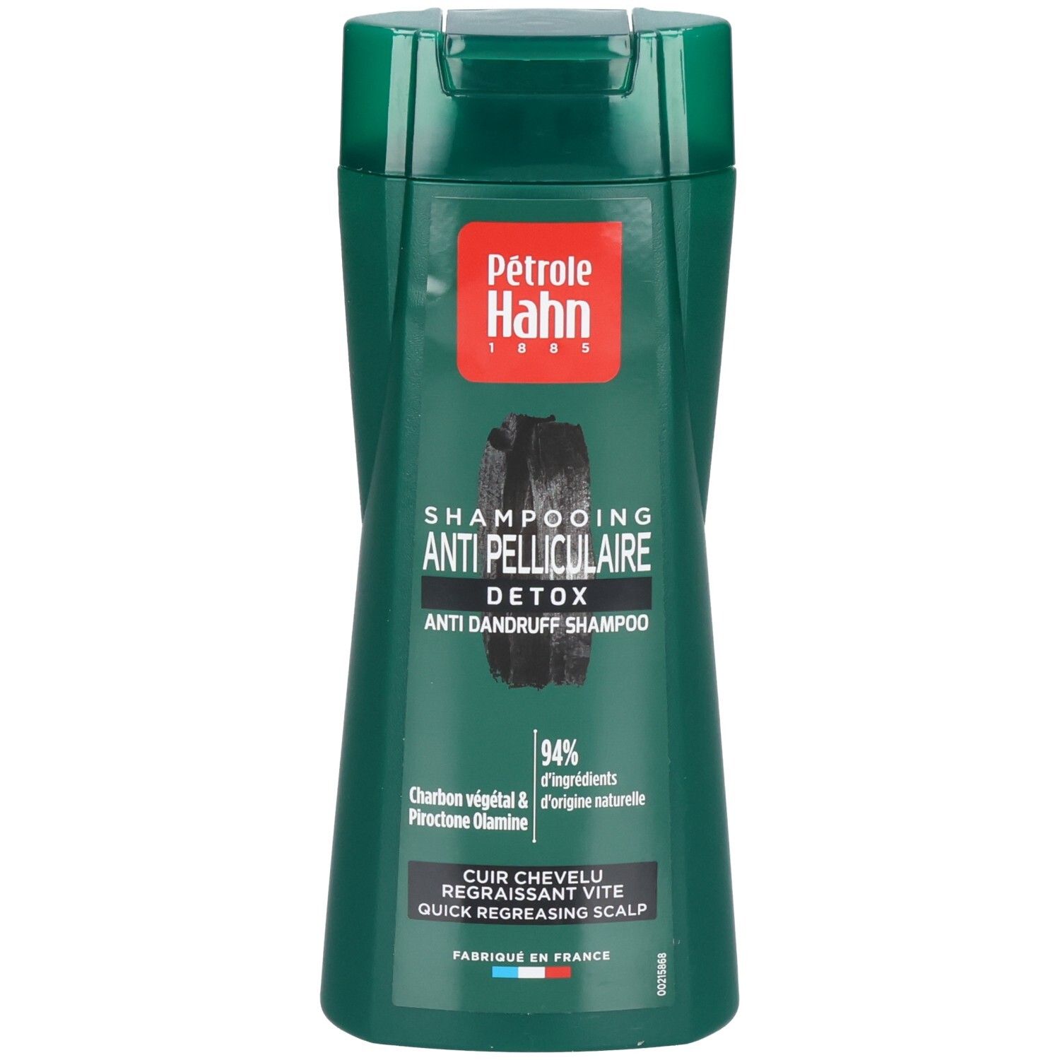 Shampoing antipelliculaire Détox Petrole Hahn dans une bouteille verte avec motif charbon.