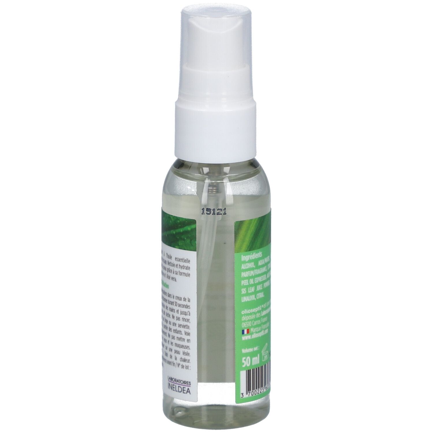 Flacon transparent avec vaporisateur blanc. Étiquette avec nom du produit et accents verts. Texte: Spray Lavant, Ingrédients.