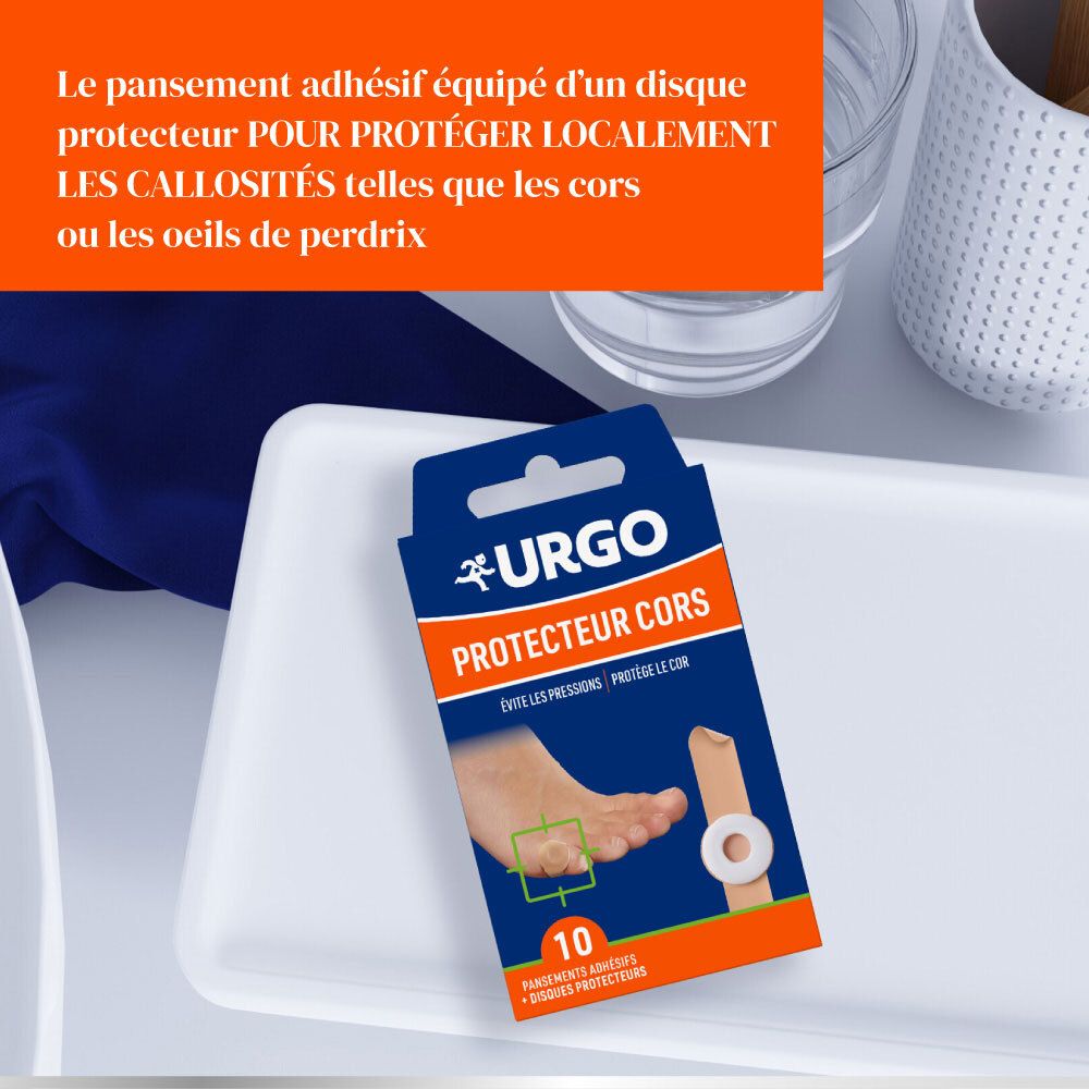 Boîte URGO Protecteur Cors sur plateau blanc. Texte: 'Le pansement adhésif équipé d'un disque protecteur...'.