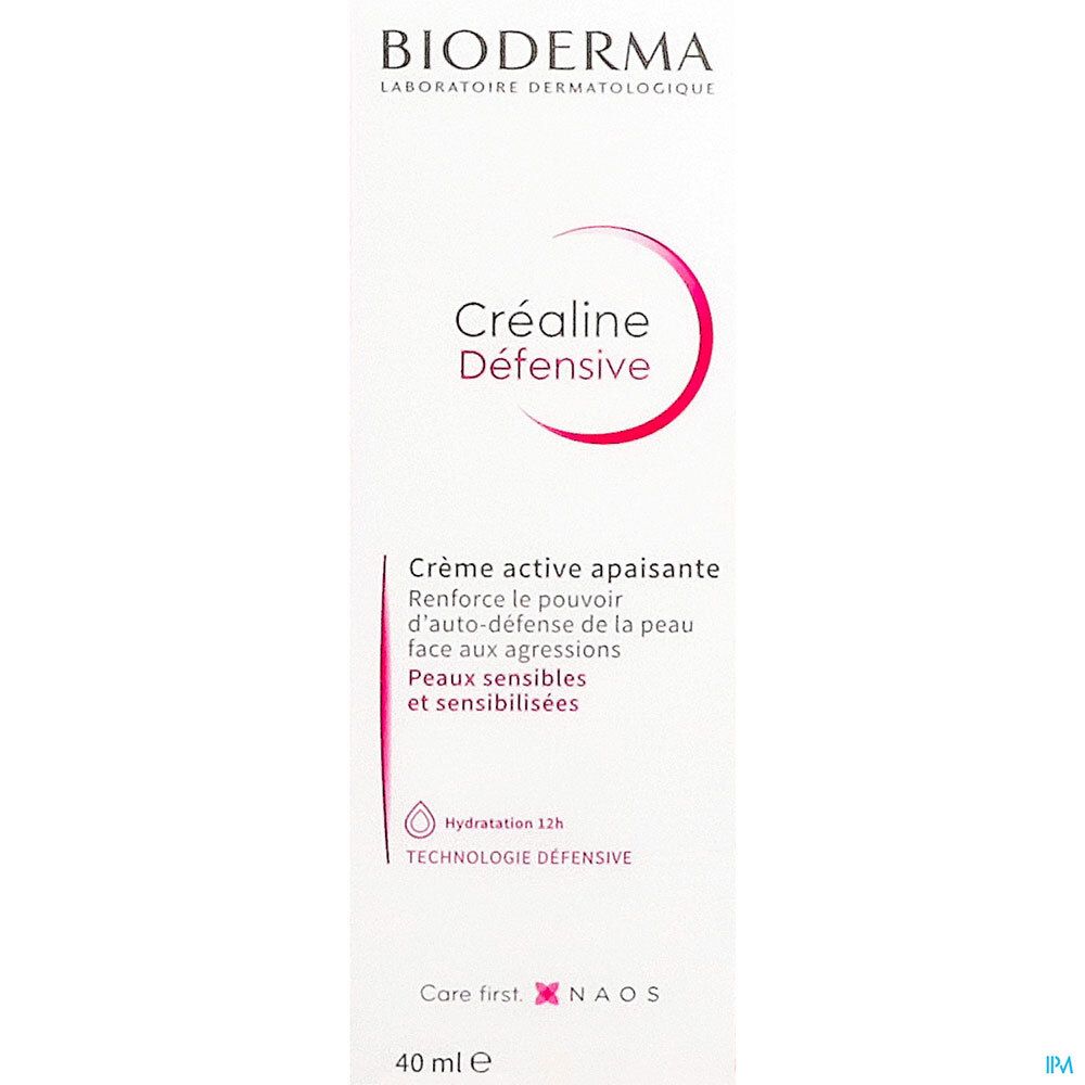 Gros plan sur l'emballage de Créaline Défensive Crème Active Apaisante. Blanc, rouge et rose. Texte: Bioderma, Créaline Défensive, 40 ml.