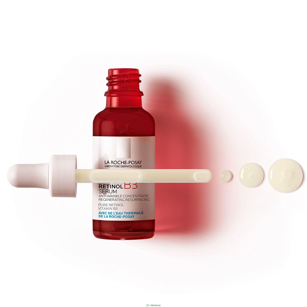 Flacon de sérum rouge avec pipette et gouttes. Texte: LA ROCHE-POSAY. Nom du produit: Retinol B3 Serum.