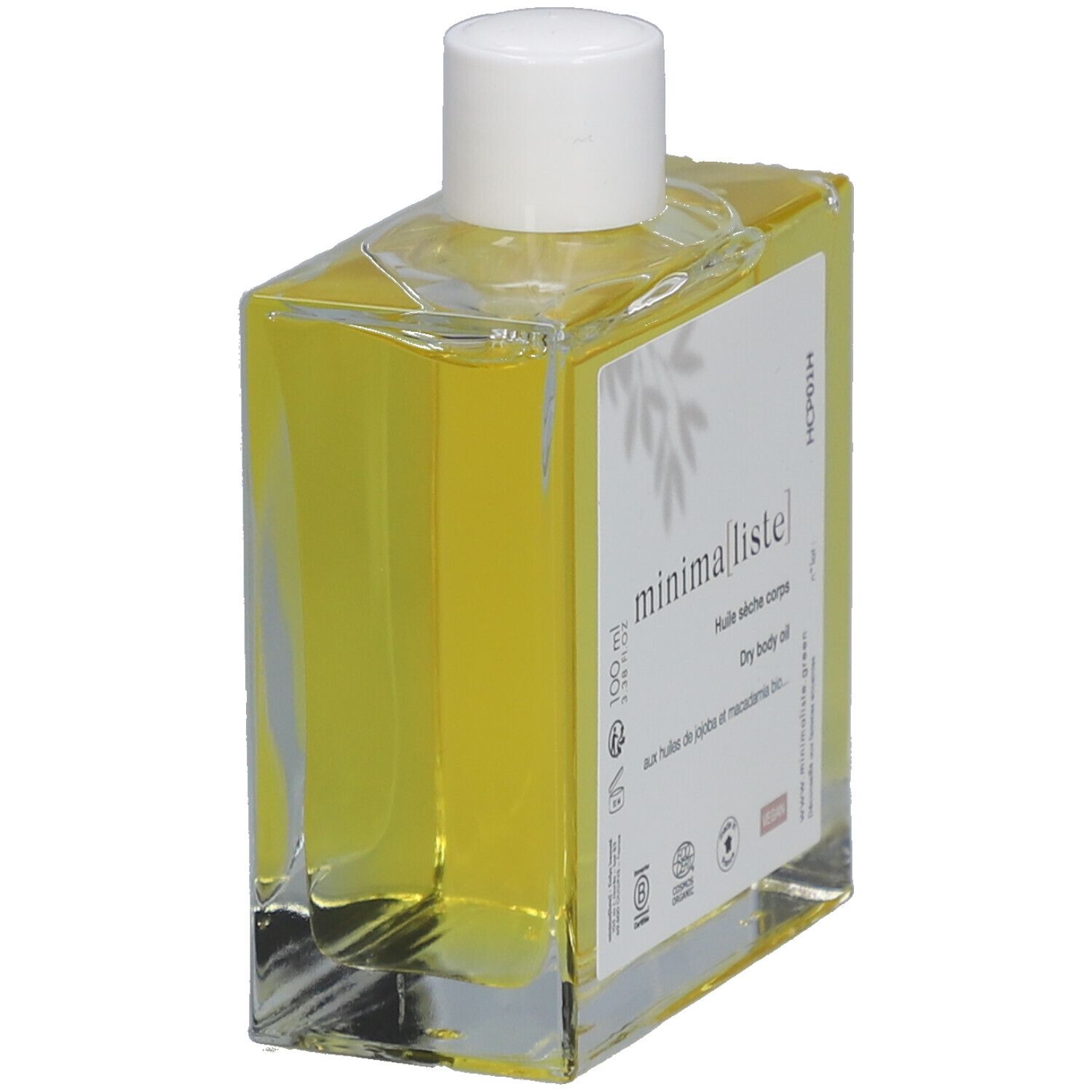 Flacon en verre avec huile jaune et bouchon blanc. Étiquette avec nom du produit et informations. Vue oblique.