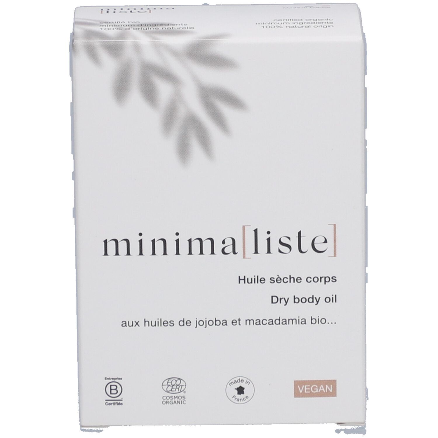 Emballage blanc avec nom du produit et informations. Inscription 'Huile sèche corps' et logos.
