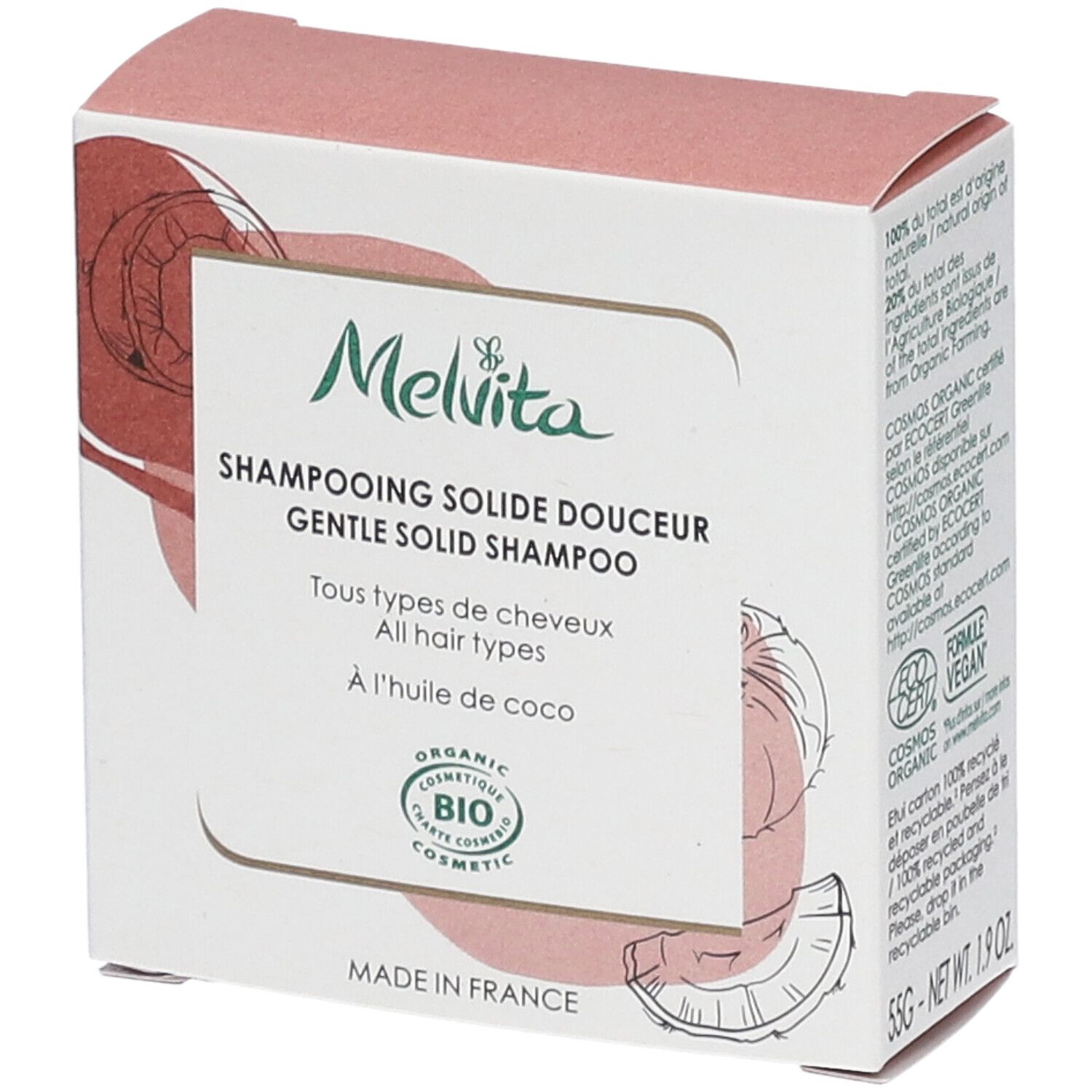 Boîte de shampooing solide Melvita. Inscription : "Shampooing solide douceur", "BIO COSMETIC". Illustration noix de coco.