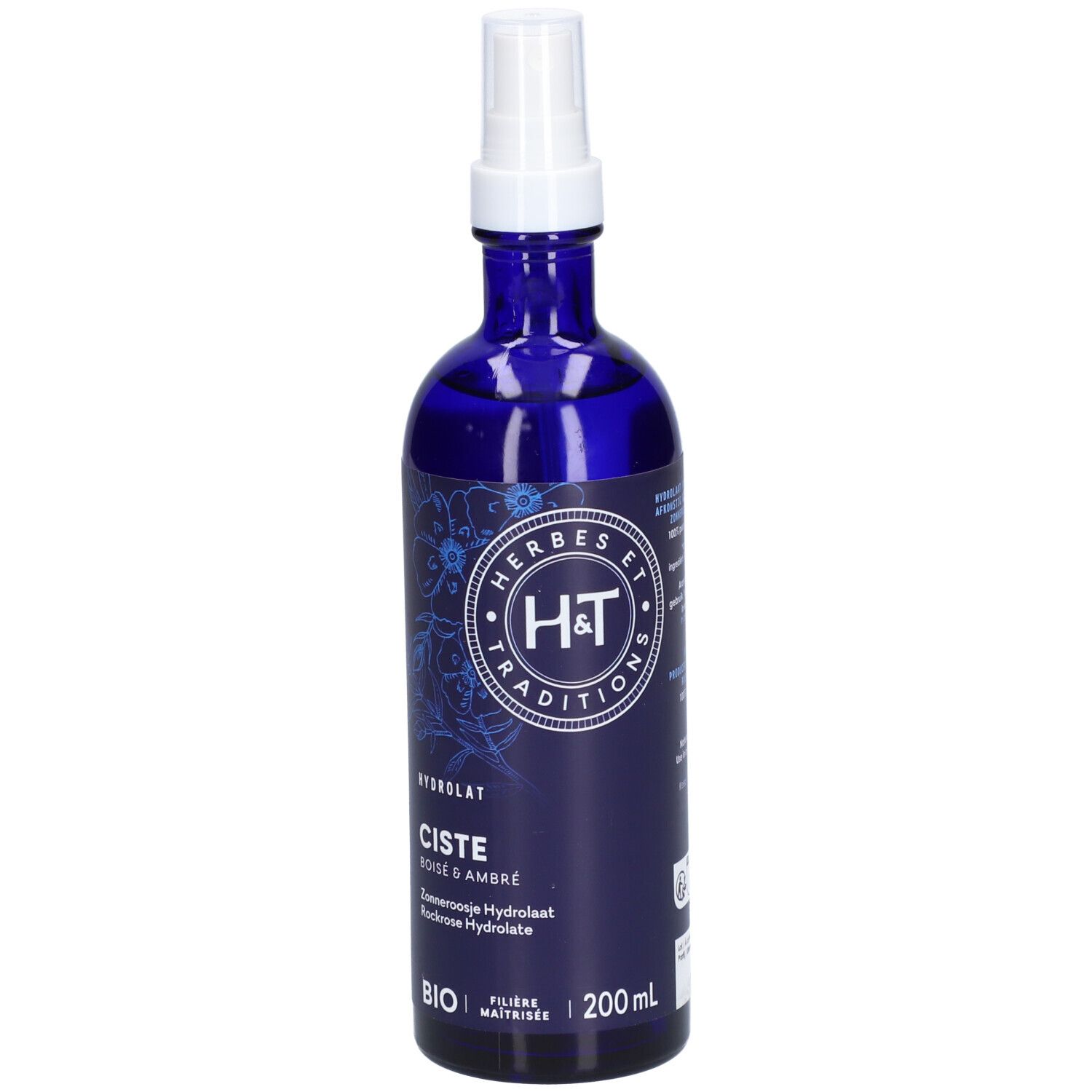 Flacon bleu foncé avec vaporisateur blanc. Inscriptions : H&T, Ciste, Bois & Ambre, Bio. 200ml.