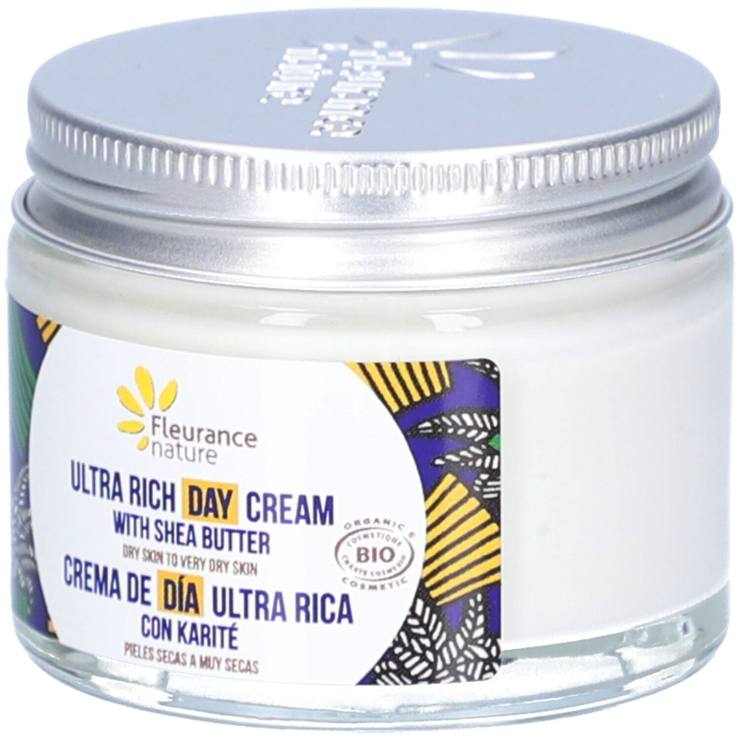 Pot de crème avec couvercle argenté. Étiquette avec texte en anglais et espagnol. Certification bio.