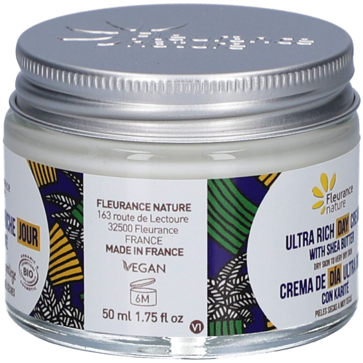 Pot de crème avec couvercle argenté. Étiquette avec adresse, logo végan et certification bio. 50 ml.