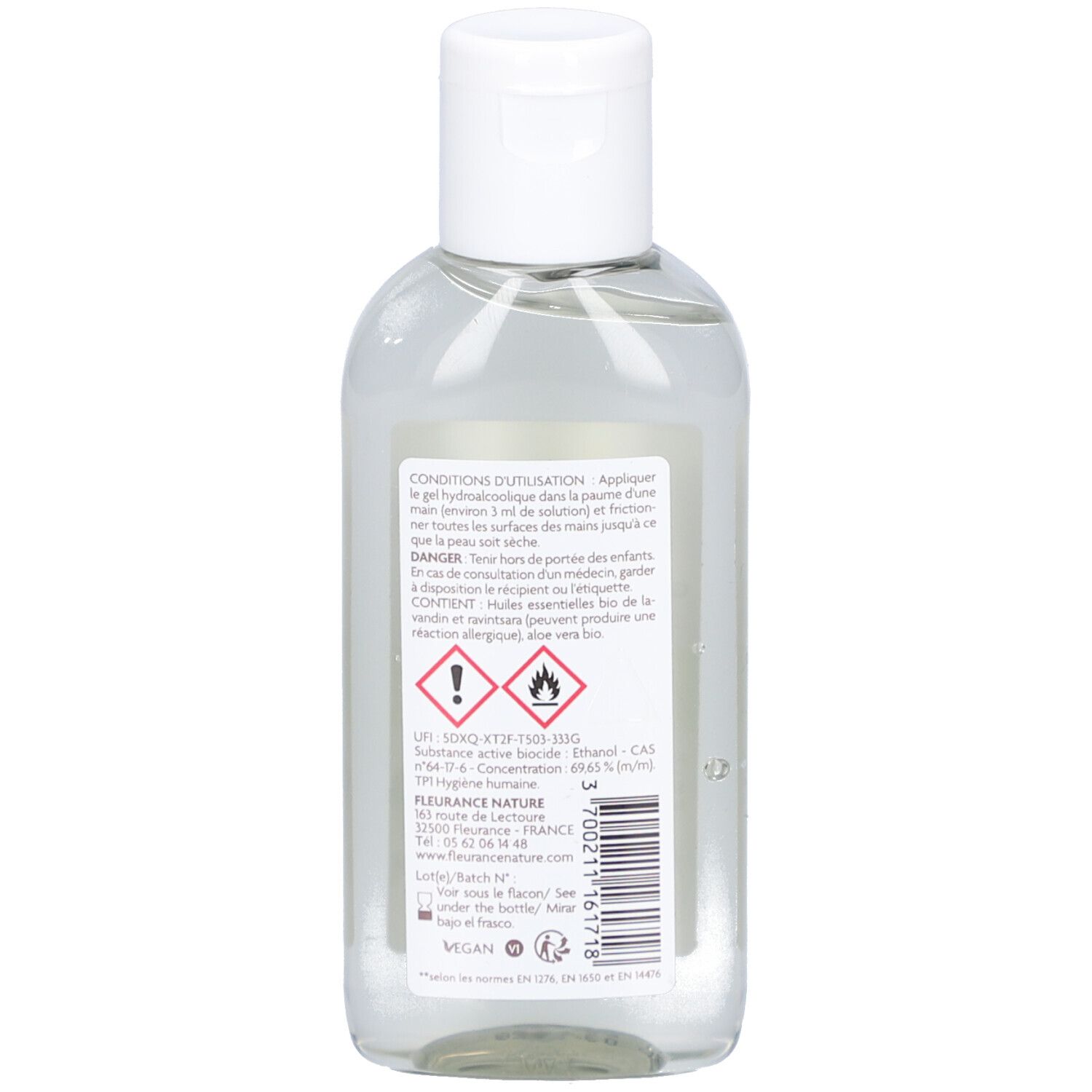Dos d'un flacon transparent avec bouchon blanc. Étiquette avec texte et symboles d'avertissement.