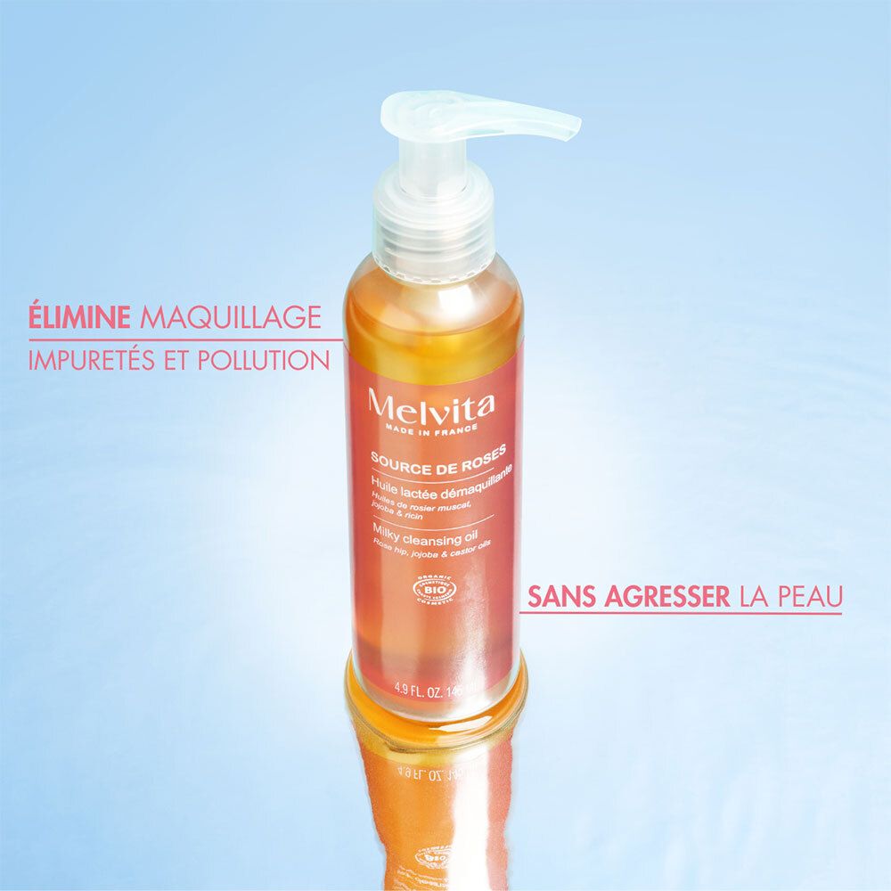 Flacon avec pompe, liquide jaunâtre. Texte: Melvita, Source de Roses. Texte: Élimine maquillage, impuretés et pollution.