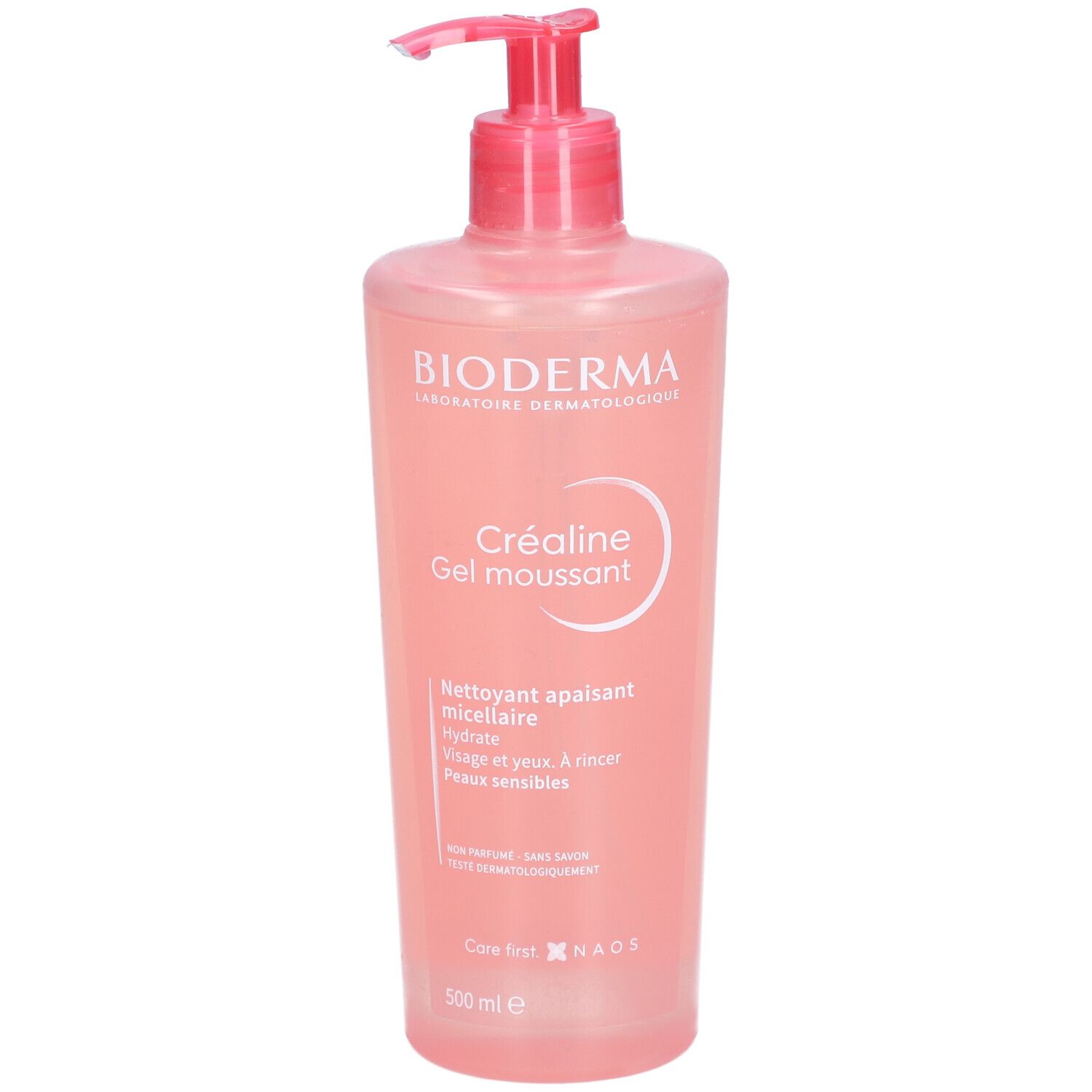Flacon rose avec pompe. Inscription: BIODERMA, Créaline Gel moussant. Gel micellaire nettoyant pour peaux sensibles.