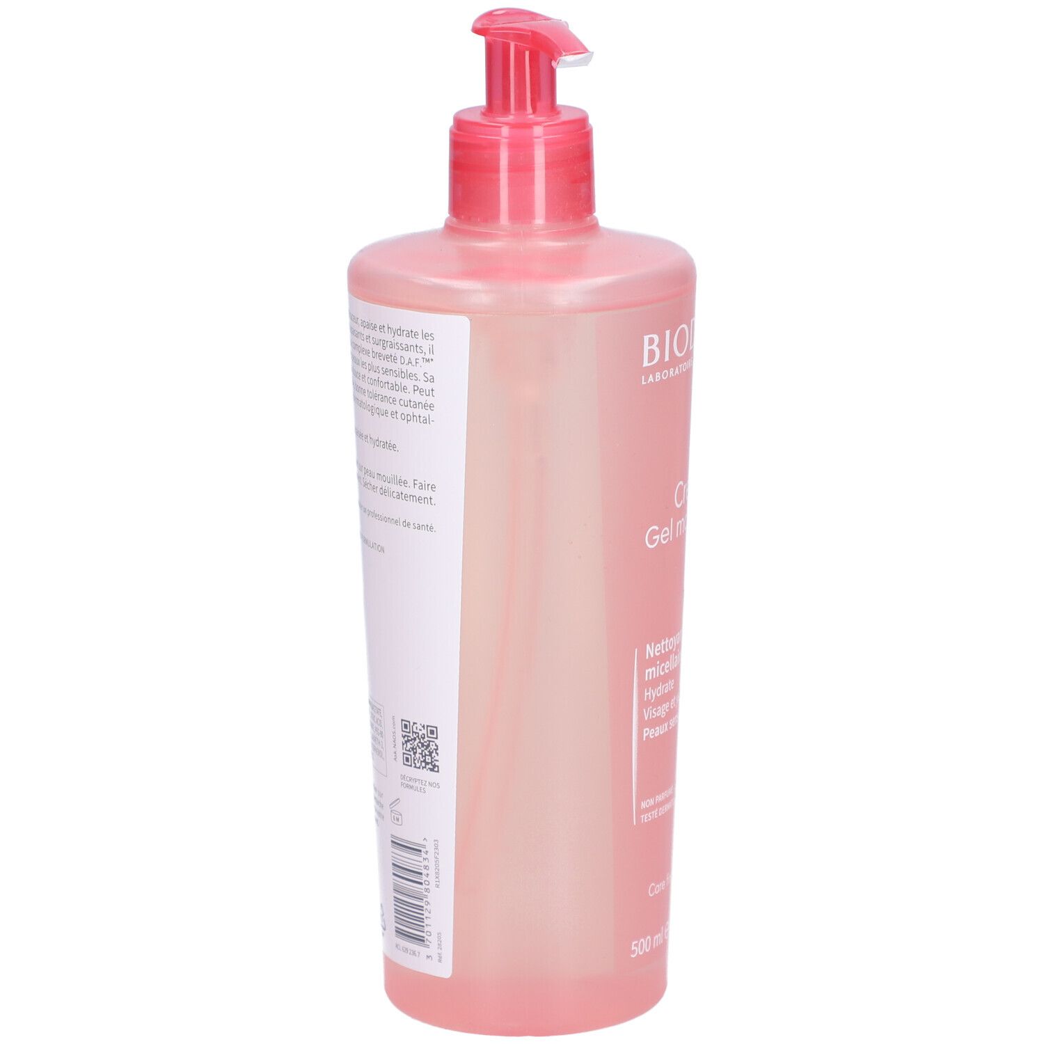 Vue arrière du flacon rose avec pompe. Texte sur l'étiquette. Code QR et informations sur le produit.