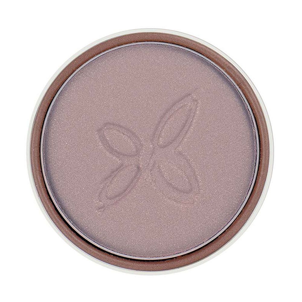 Boîte ronde marron avec fard à paupières Clay. Logo blanc. Bord intérieur blanc.