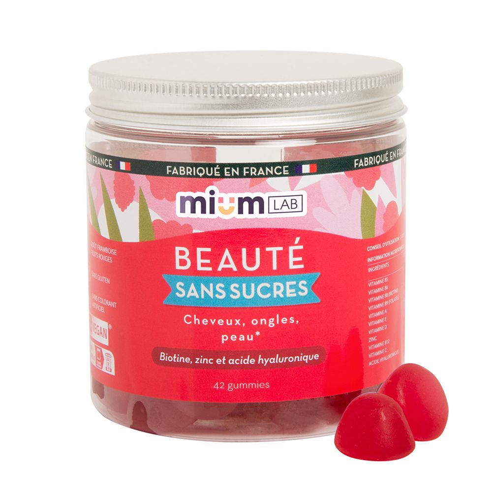 Pot rond de gummies rouges et deux gummies à côté. Inscription : mium LAB, Beauté sans sucres. 42 gummies.