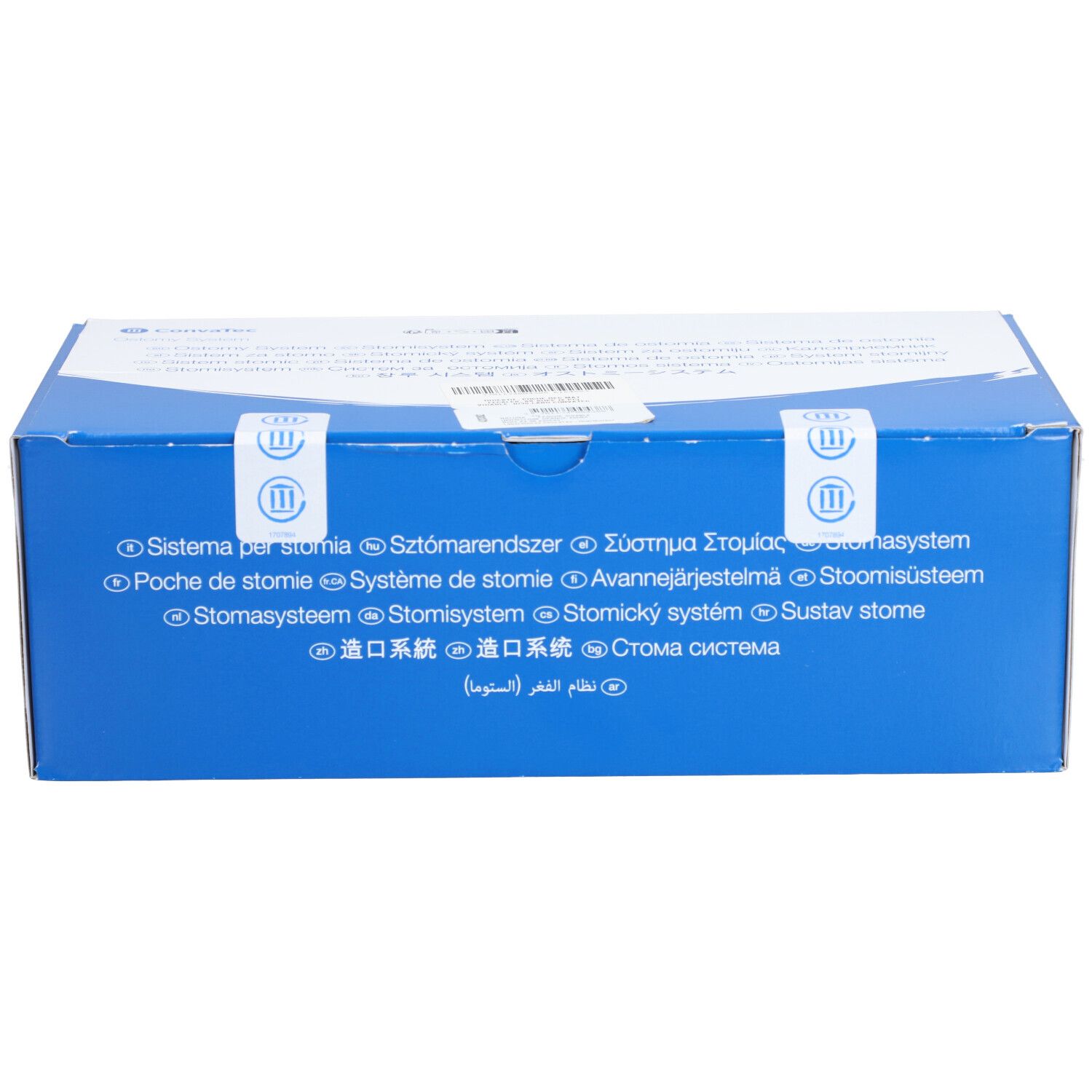 Boîte bleue avec texte multilingue. Sceaux avec symboles. Inscriptions: Système pour stomie, Poche de stomie, Stomasysteem.
