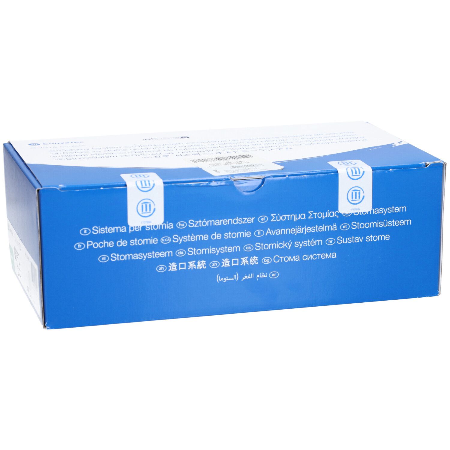 Boîte bleue avec texte multilingue. Sceaux avec symboles. Inscriptions: Système pour stomie, Poche de stomie, Stomasysteem.