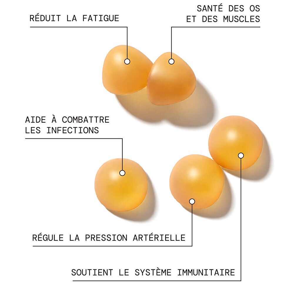 Pot de gummies à la vitamine D. Deux gummies jaunes à côté. Inscription : Vitamine D, sans sucres.